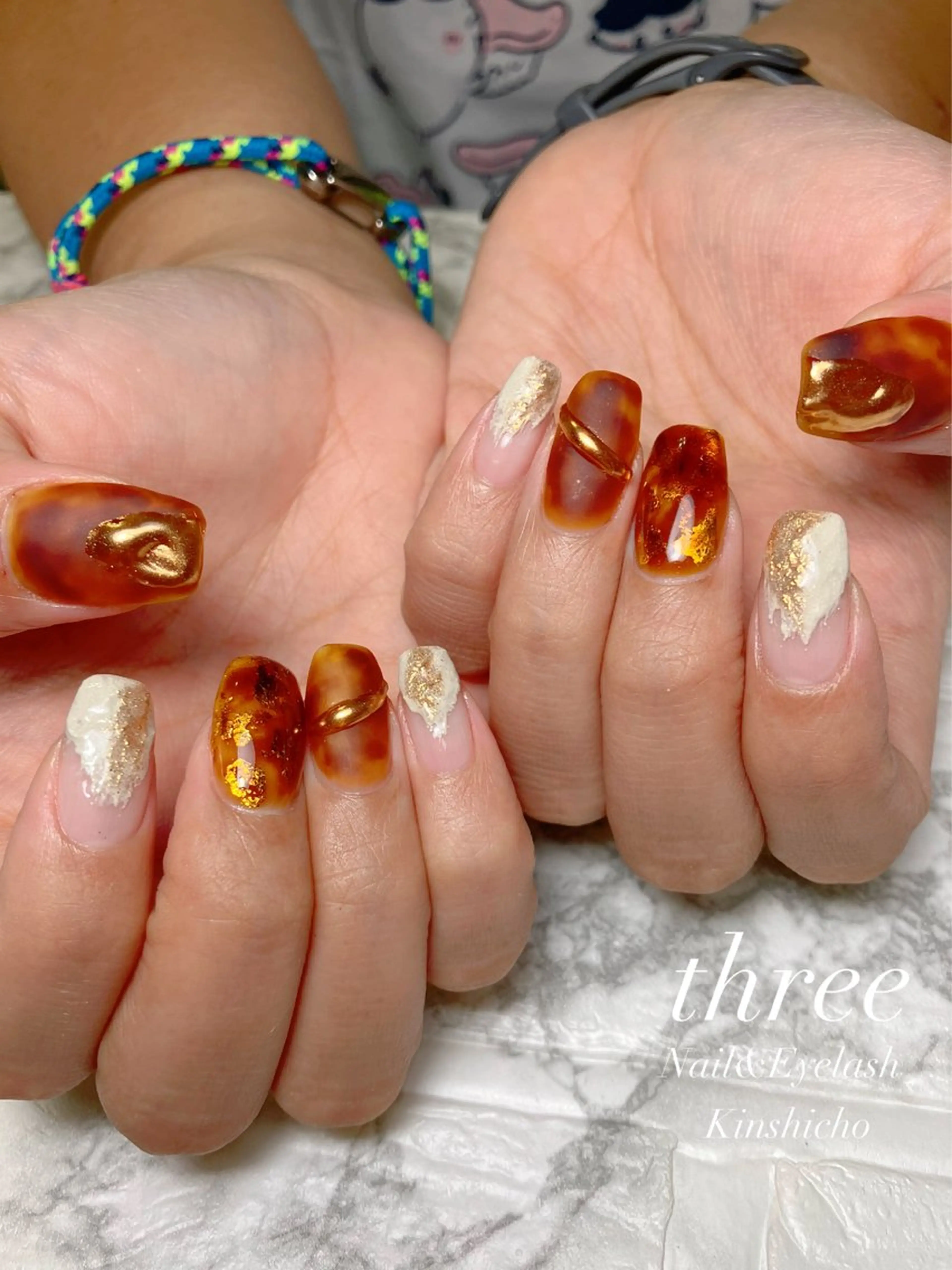 ネイル べっ甲ネイル ニュアンスネイル ハンドネイル three Nail&Eyeのネイルデザイン