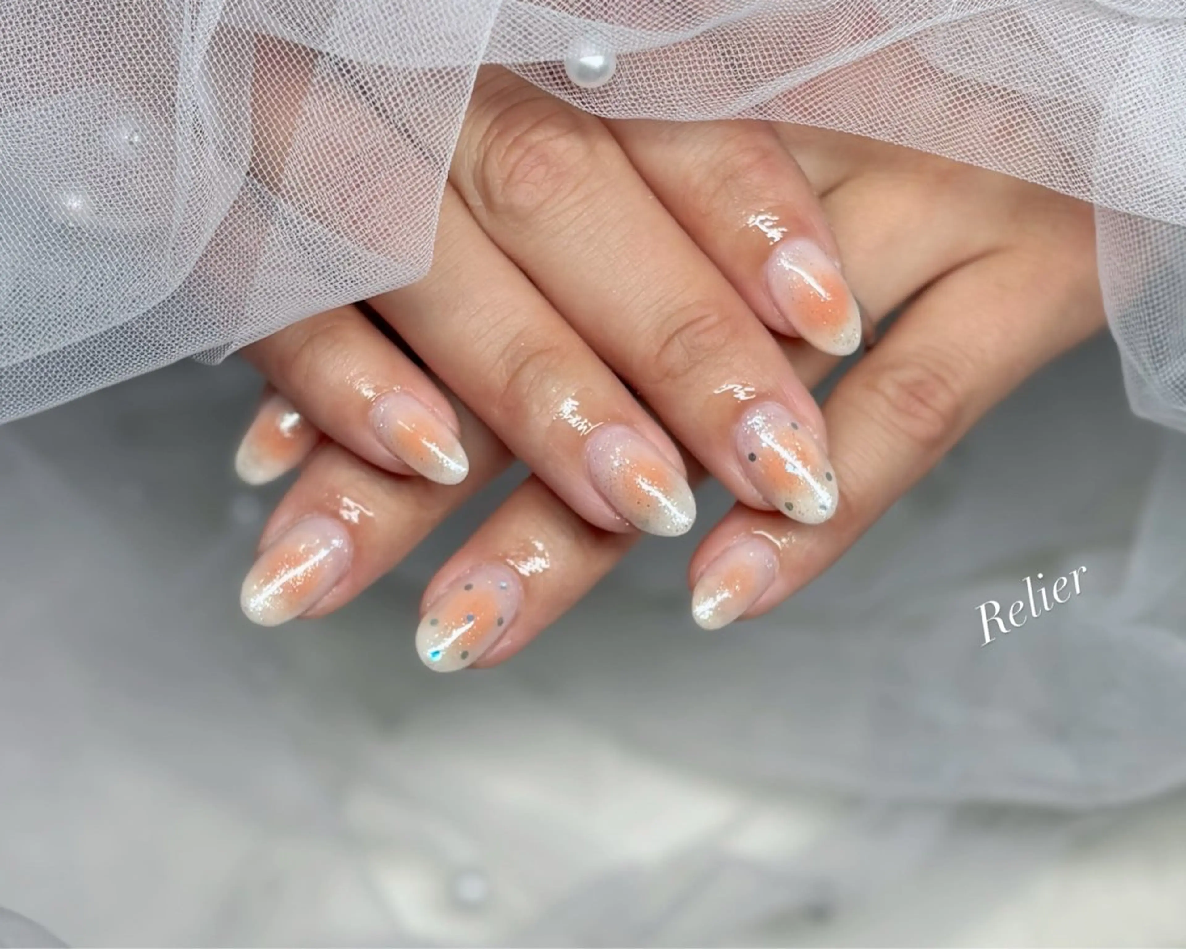 ネイル チークネイル オレンジ Nail salon Relierのネイルデザイン