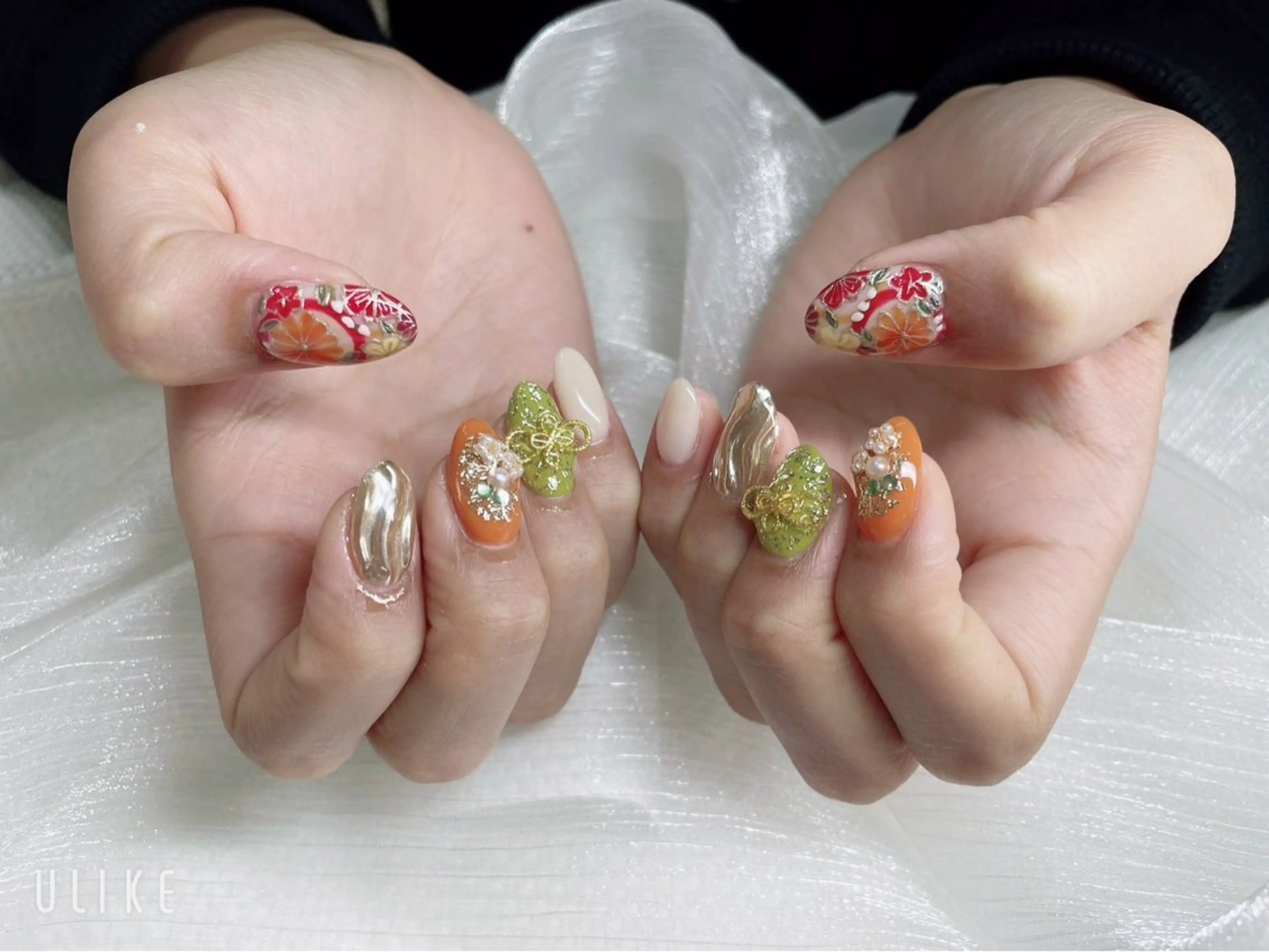 ネイル アートネイル 成人式 オレンジ リボン Nail salon CELEBRAILのネイルデザイン