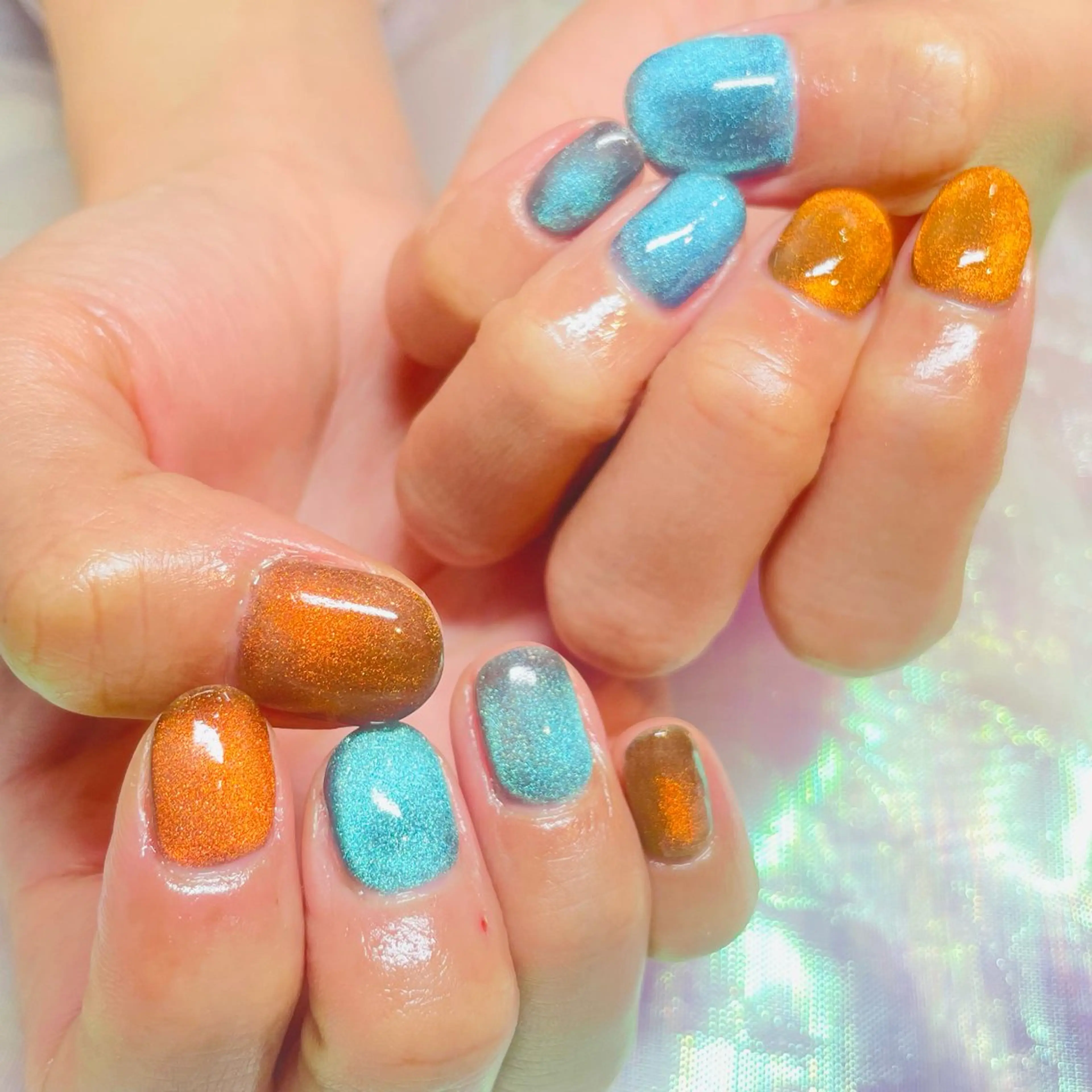 ネイル ブルー キラキラネイル マグネットネイル オレンジ k+1💅nail salon所属・k+1 nail salonのネイルデザイン