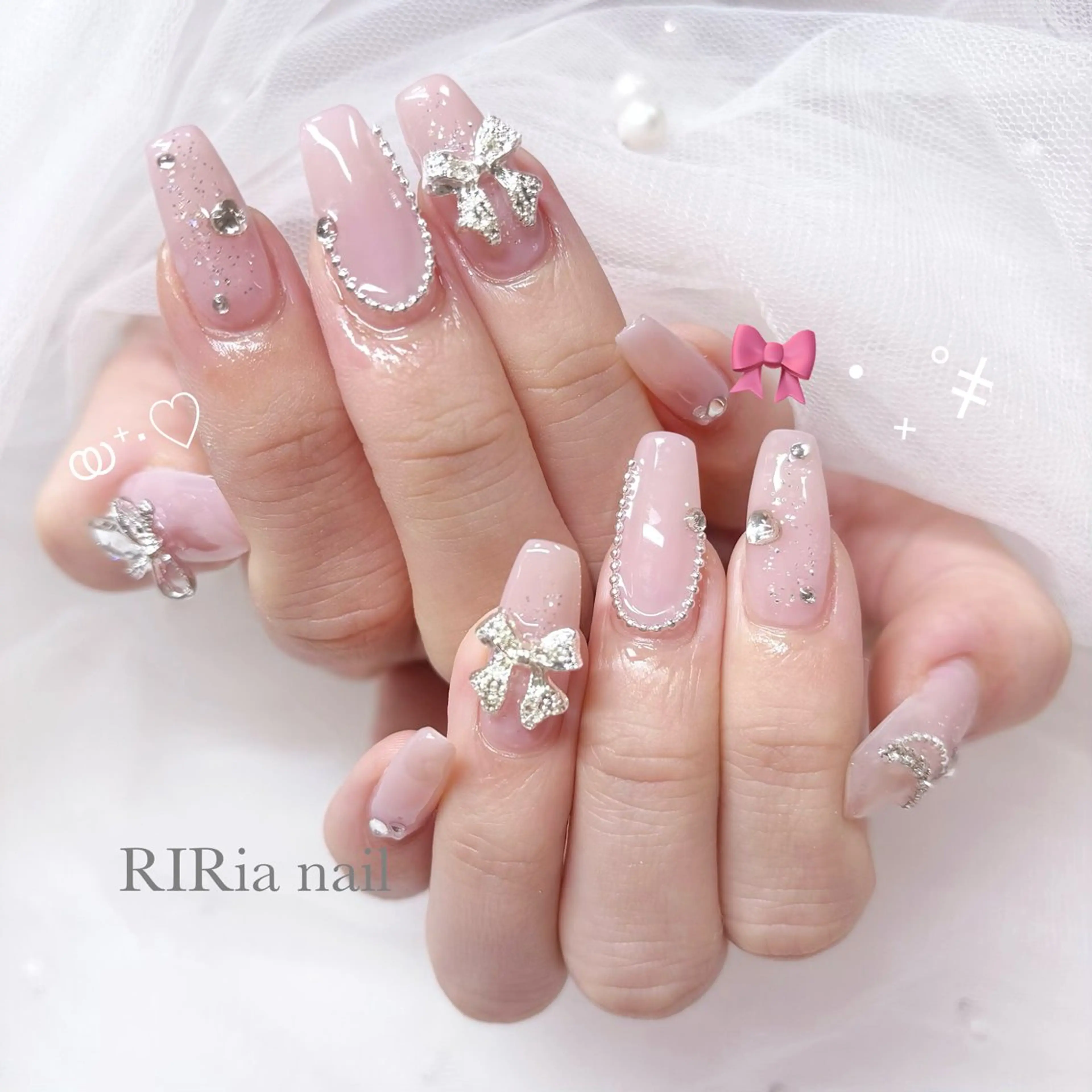 ネイル ピンク ピンクベージュ リボン ハンドネイル RIRia .のネイルデザイン