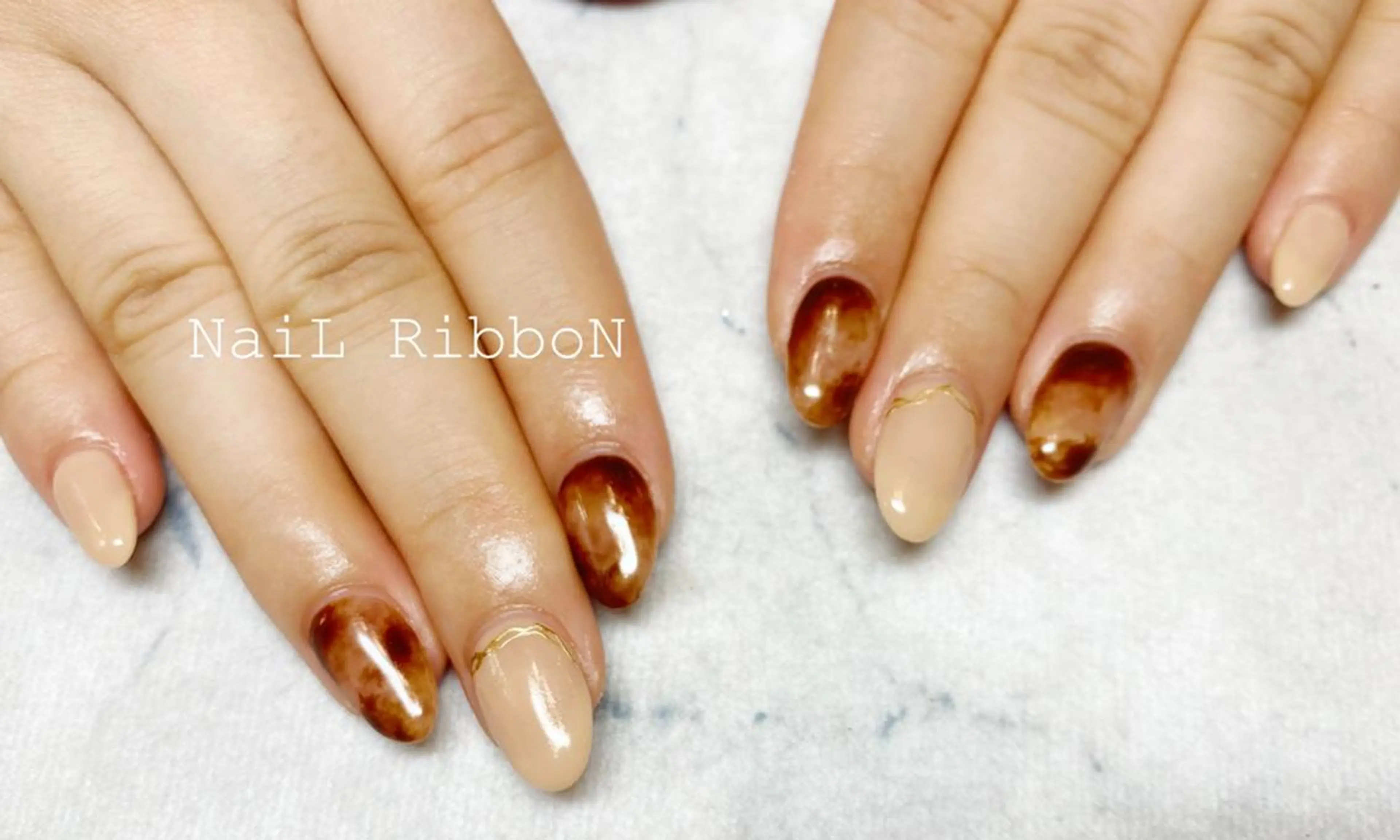 ネイル ネイルリボン 受付スタッフのネイルデザイン