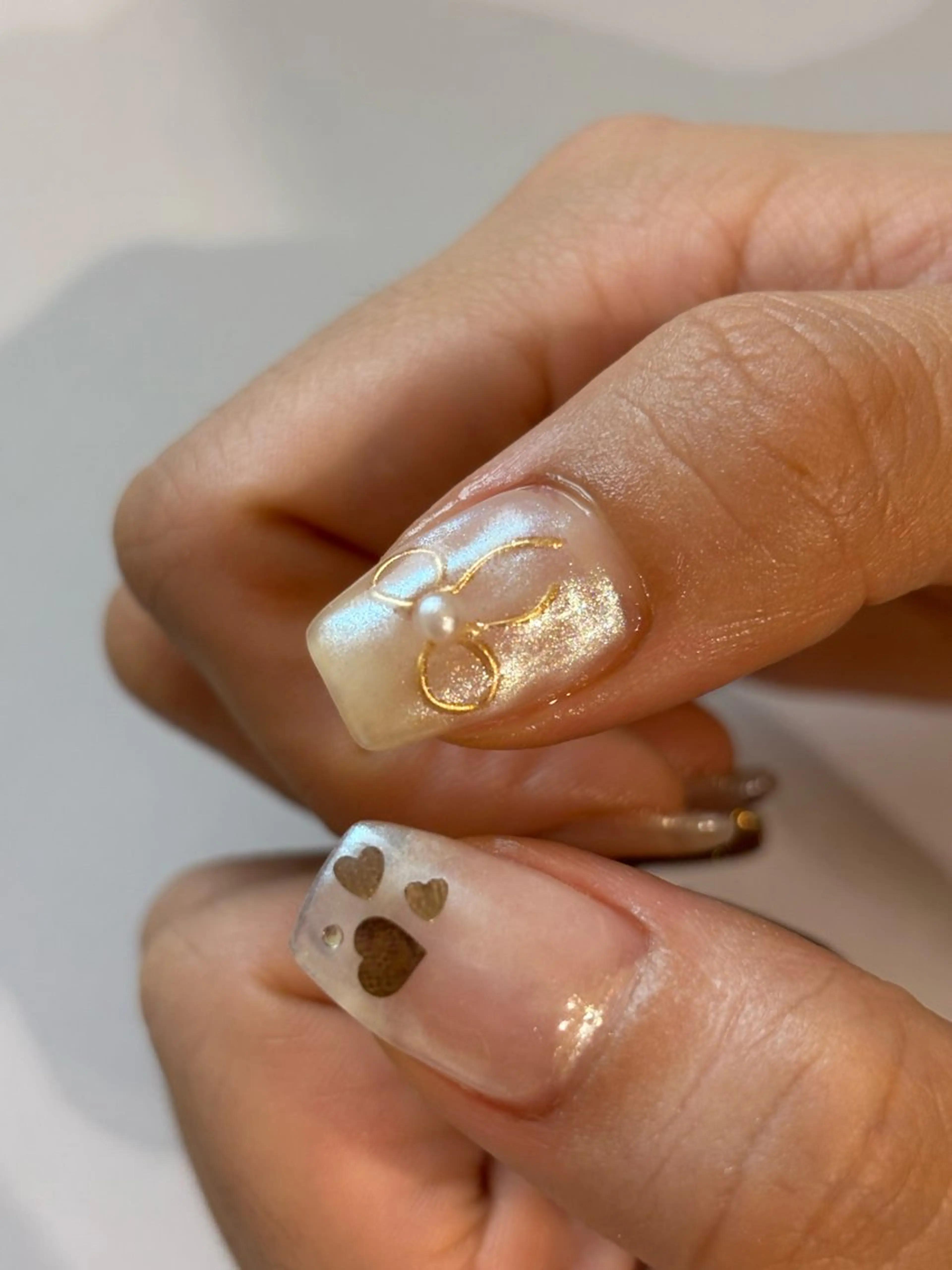 ネイル オーロラネイル ハート ニュアンスネイル リボン 冬ネイル ハンドネイル Ann. nail.tokyo所属・Ann nailのネイルデザイン