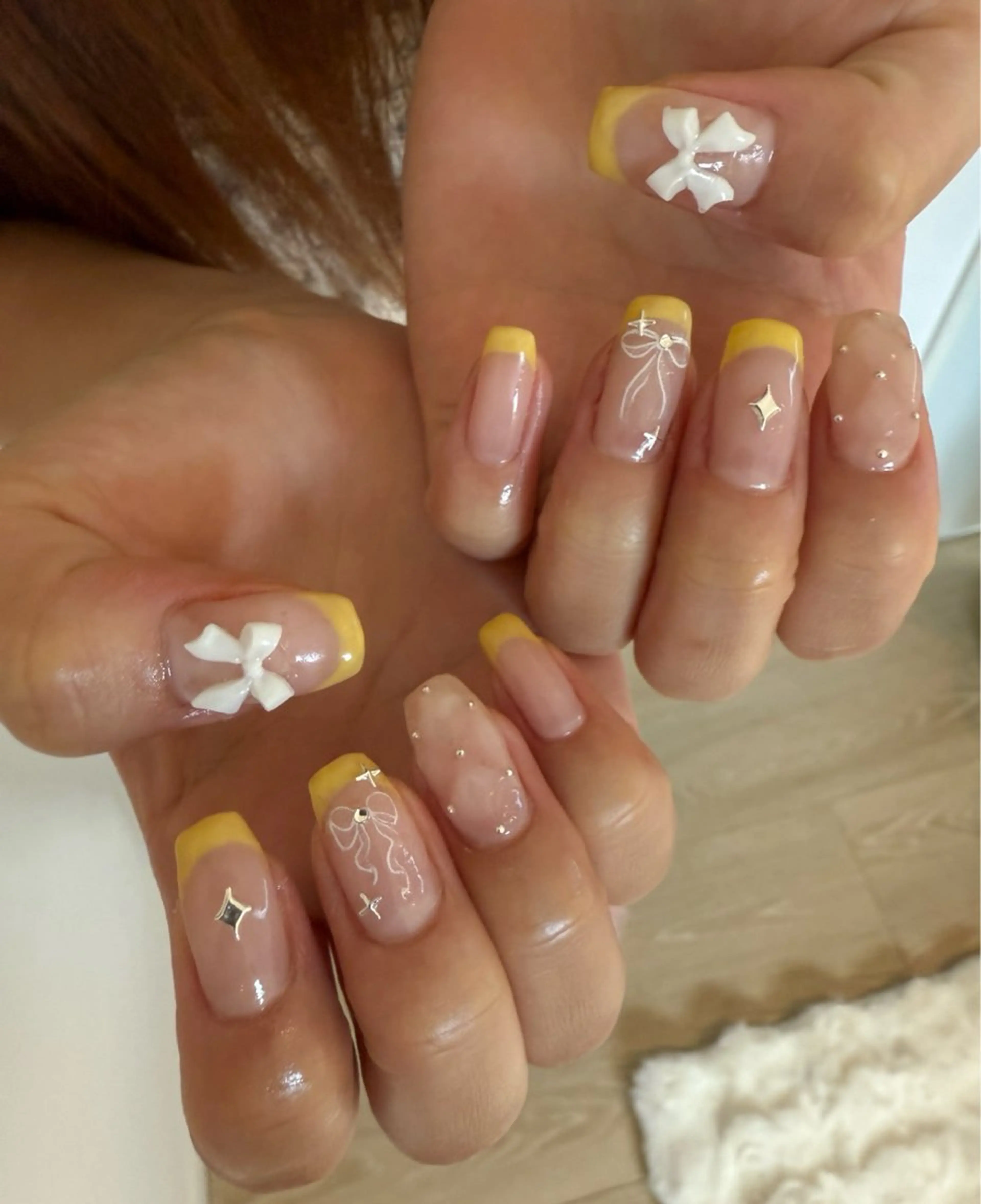 ネイル フレンチネイル 持ち込み リボン 夏ネイル 黄色 ハンドネイル nail salon Estelleのネイルデザイン