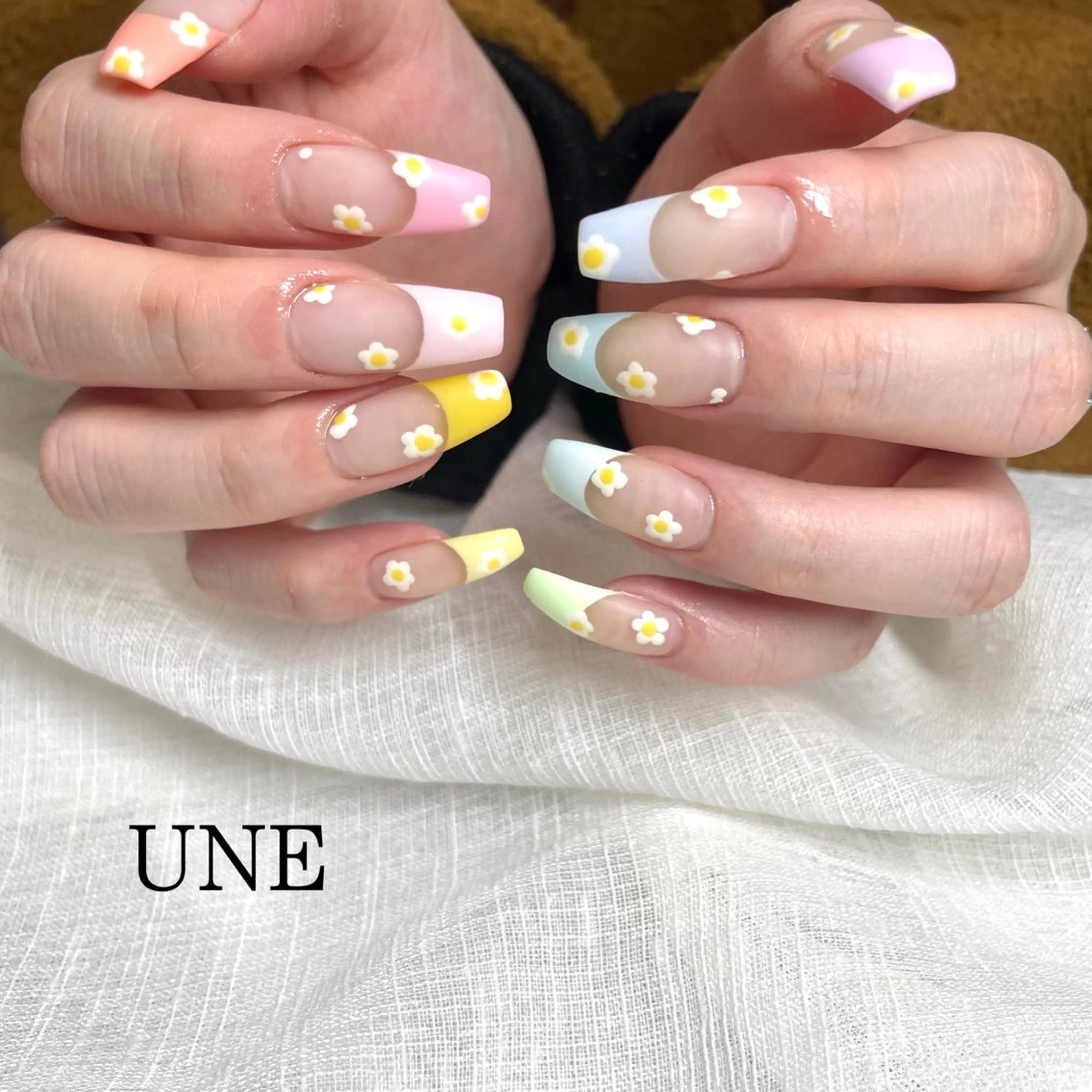 ネイル フレンチネイル パステルネイル 春ネイル UNE.【ユヌ】 Jr.NANAのネイルデザイン