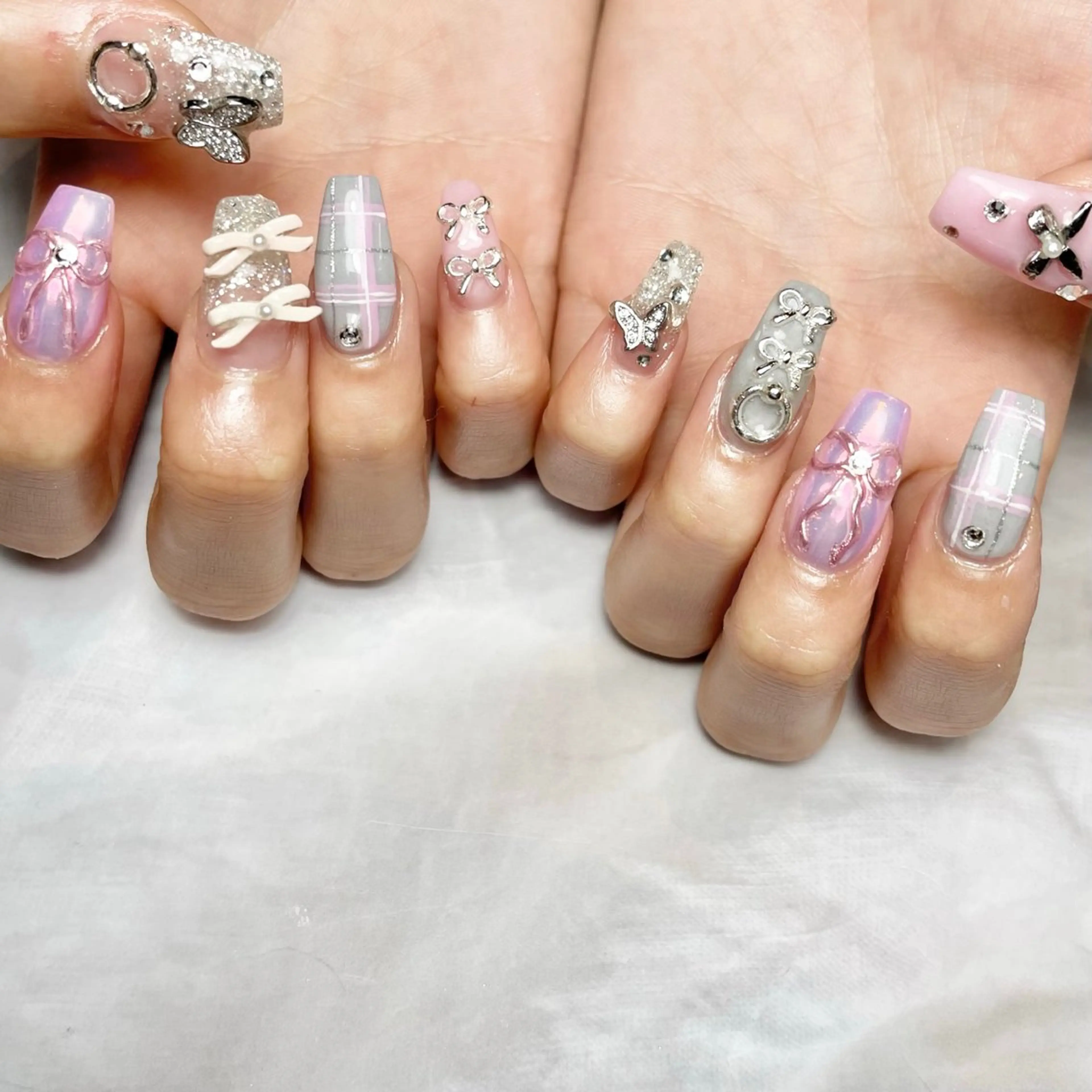 ネイル ピンク リボン シルバー ハンドネイル Reflection marikoのネイルデザイン