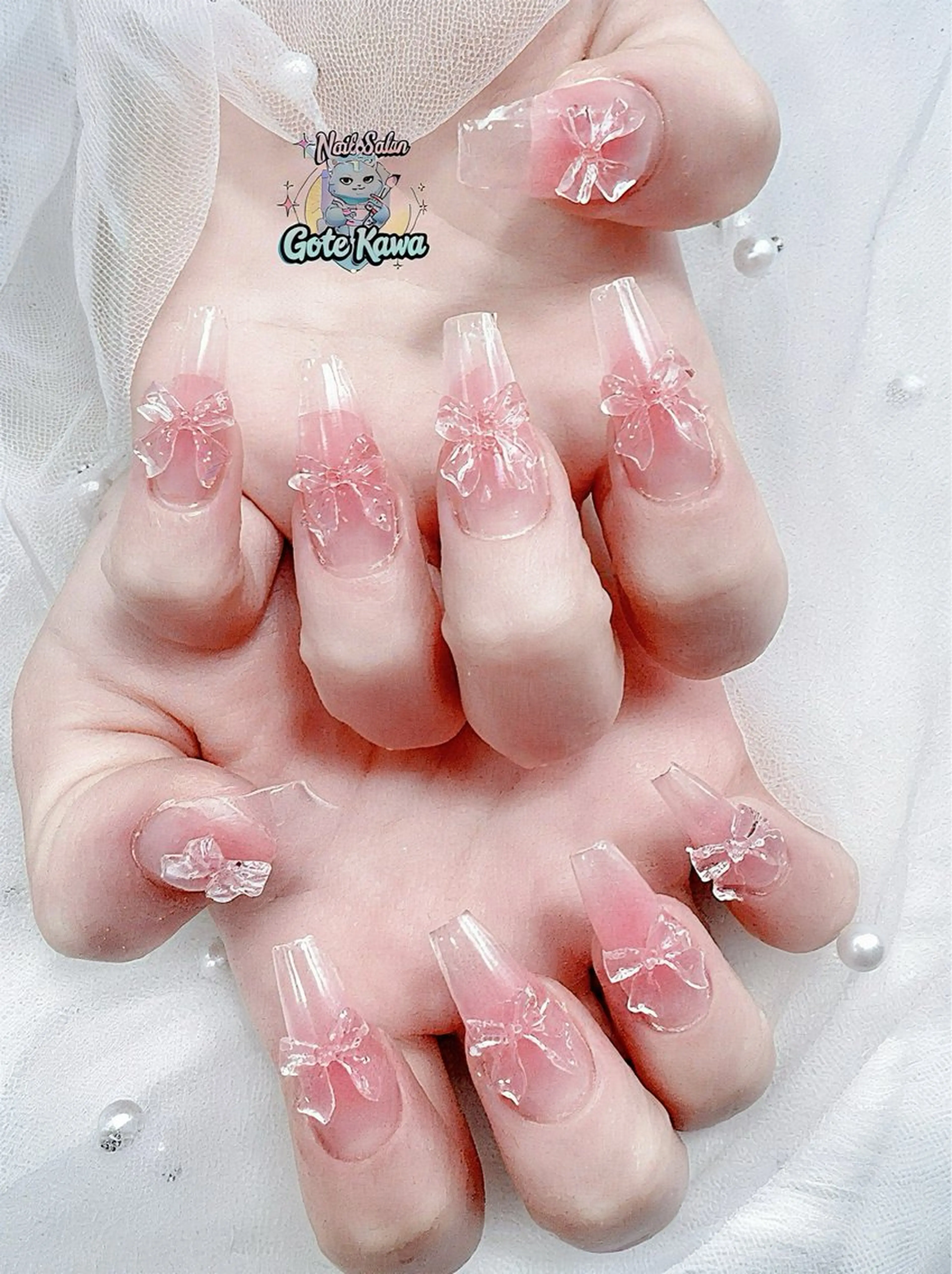 ネイル アートネイル 長さ出し キラキラネイル ピンク リボン ハンドネイル ハンドケア GOTE KAWA Nail Salon(ゴテかわ)所属・Gote Kawa nail salonのネイルデザイン