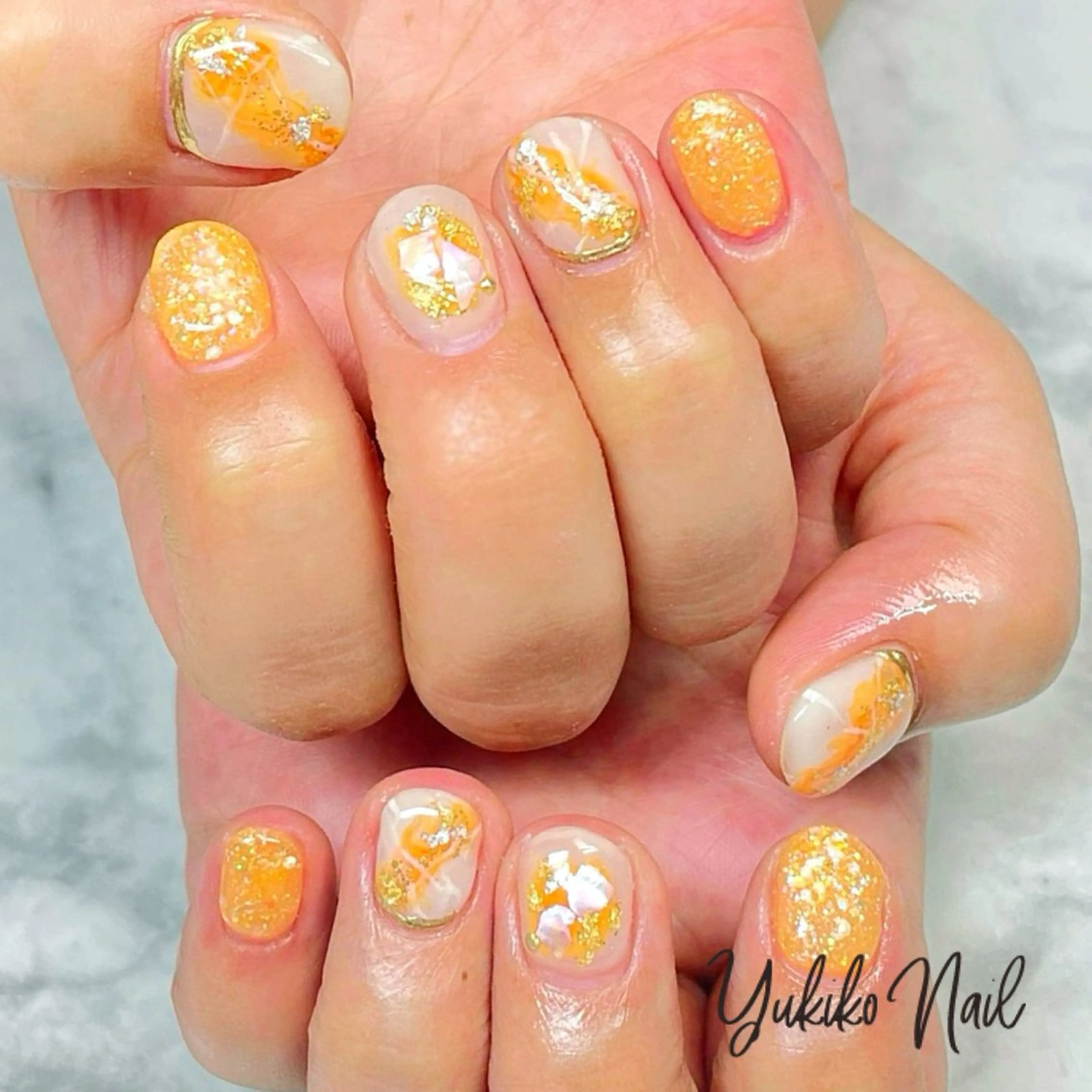 ネイル キラキラネイル 大理石ネイル(マーブル) ニュアンスネイル オレンジ ハンドネイル ユキコ ネイルのネイルデザイン