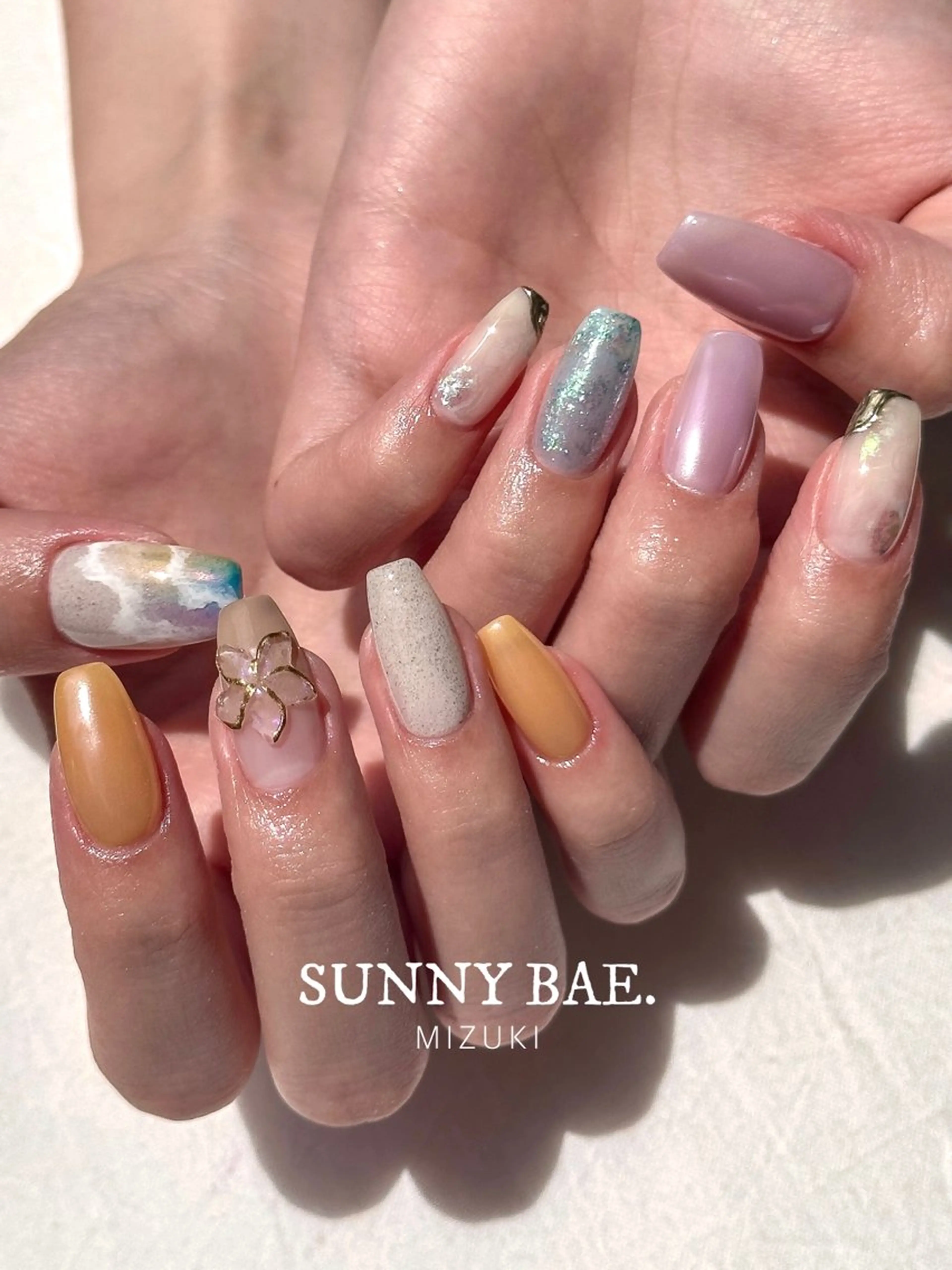 ネイル オーロラネイル ブルー オレンジ パステルネイル パープル ハンドネイル SUNNY BAE. 🌼MIZUKIのネイルデザイン