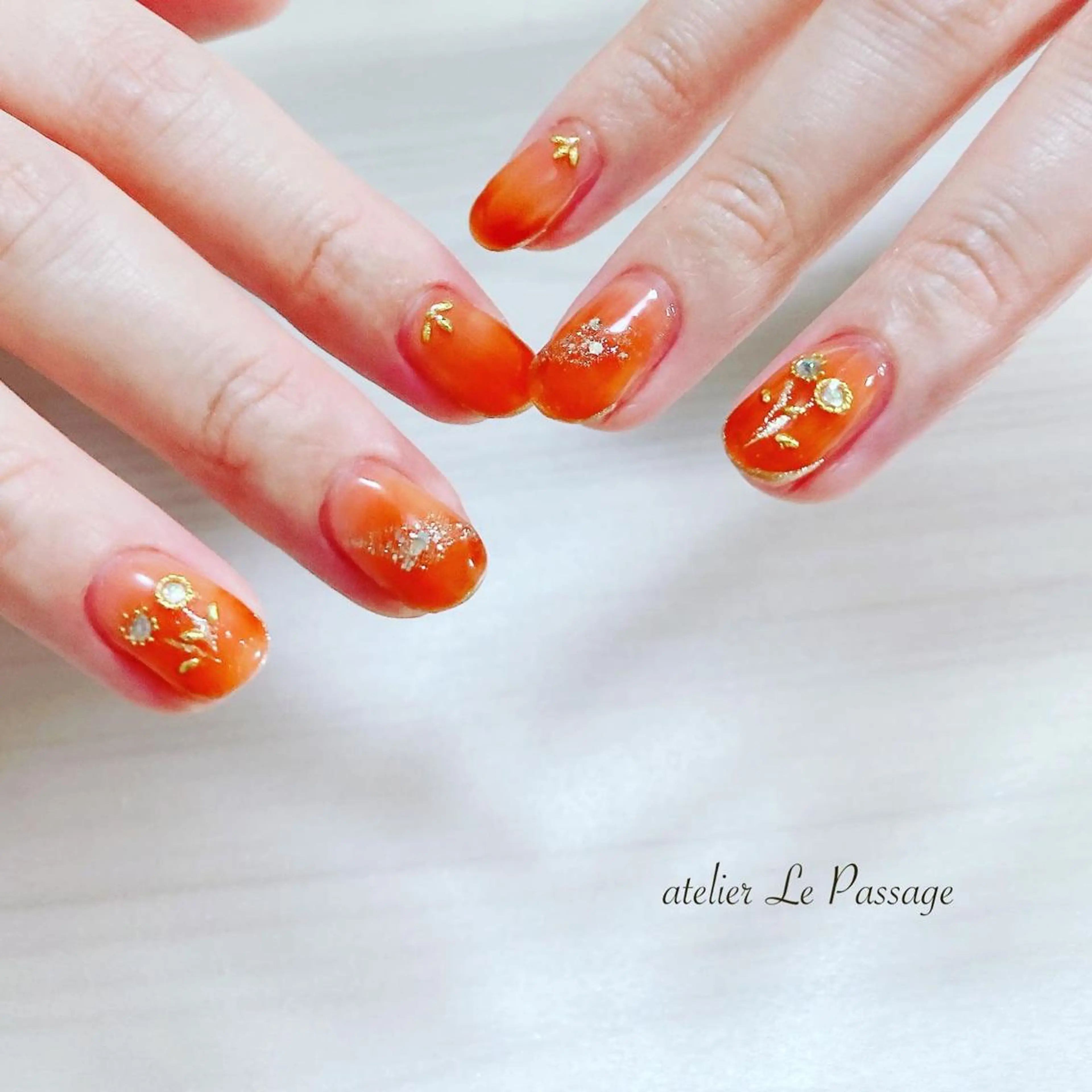 ネイル フラワーネイル ジェルネイル オレンジ パラジェル Atelier Le Passage所属・h nakatsukaのネイルデザイン