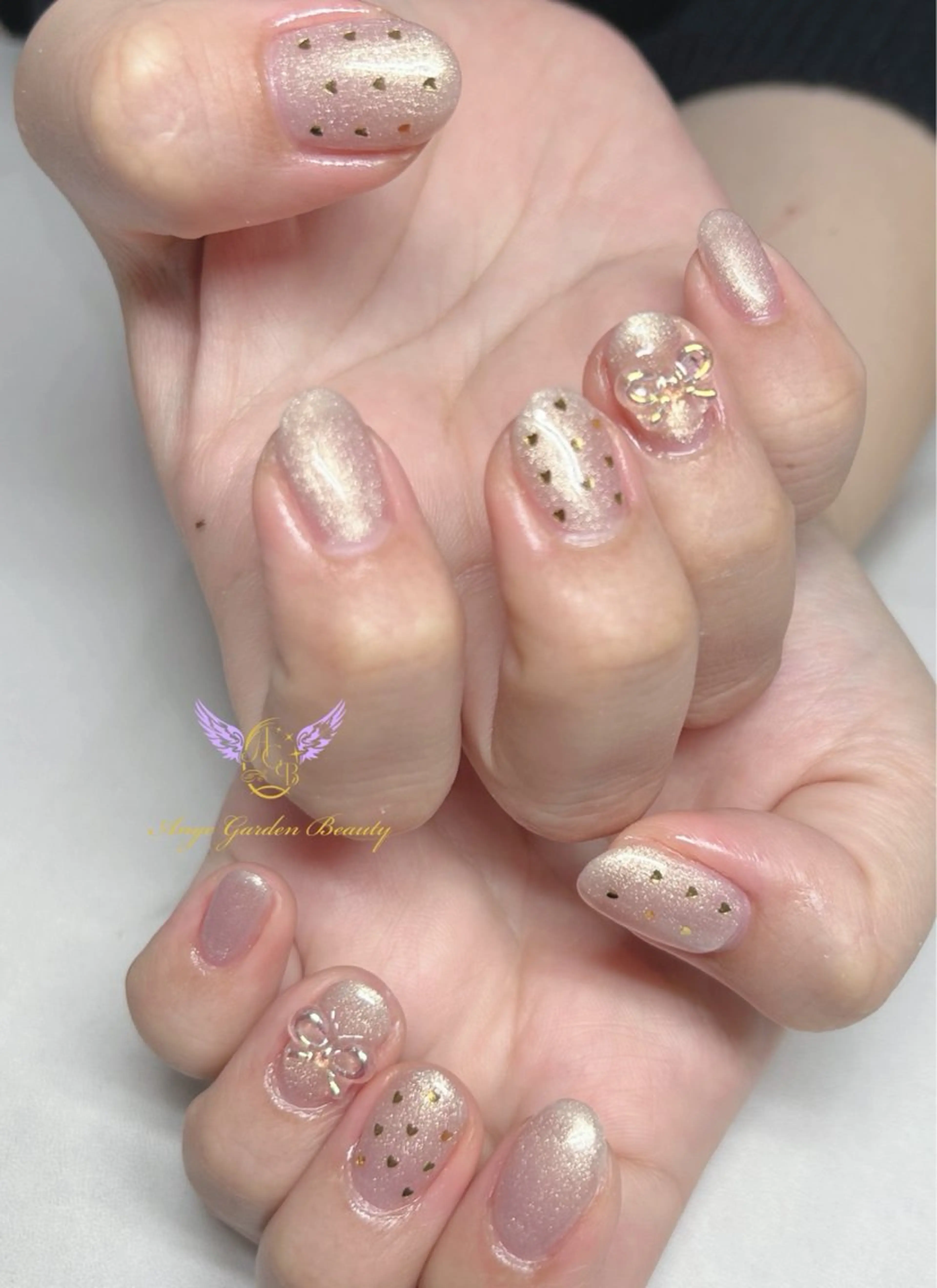 ネイル オーロラネイル クリアネイル ゴールド ハート リボン ハンドネイル AngeGarden Beautymihoのネイルデザイン