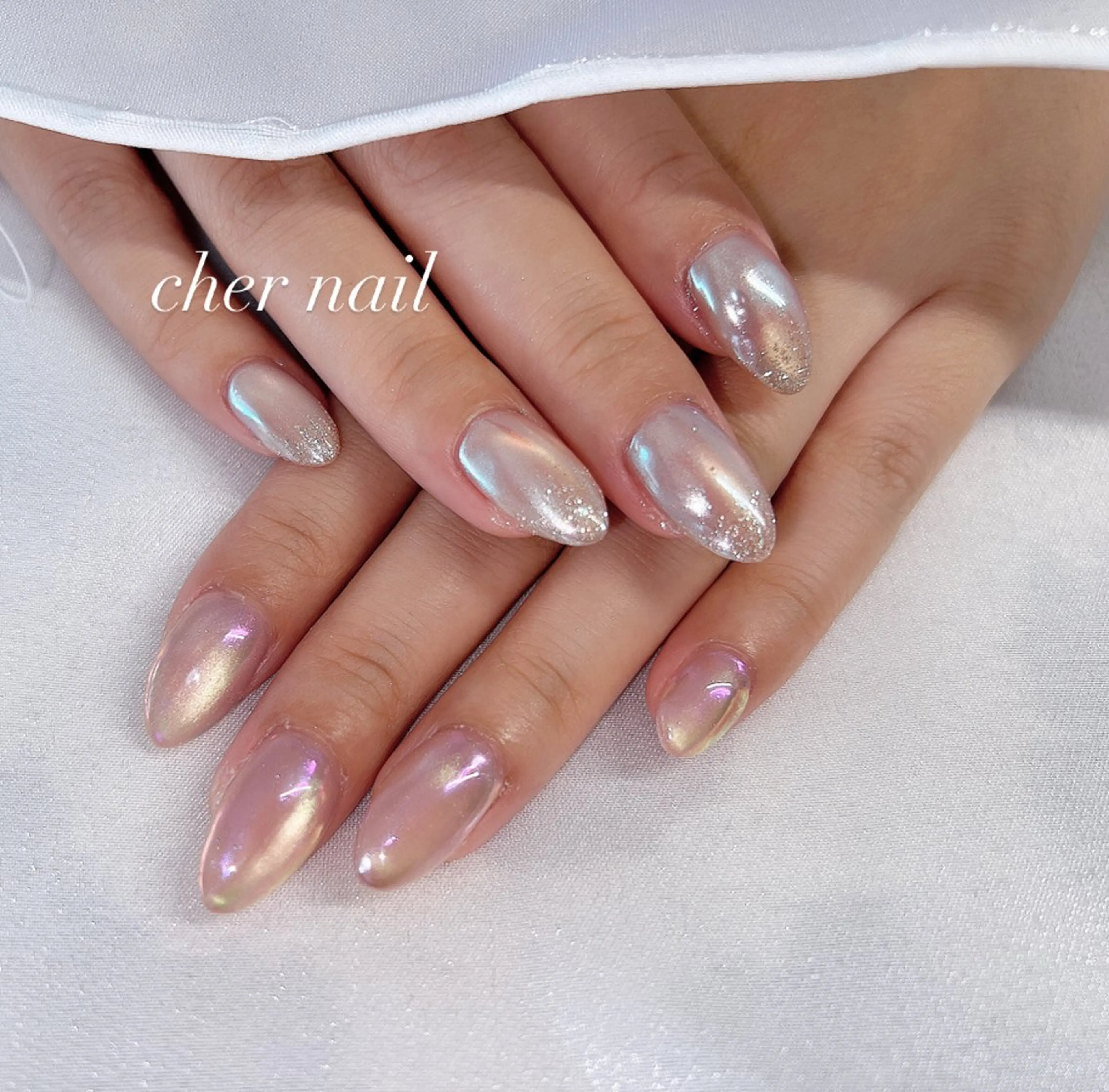 ネイル オーロラネイル フラッシュネイル 水色 ミラーネイル ピンク CHER NAIL(シェルネイル)所属・cher loydのネイルデザイン