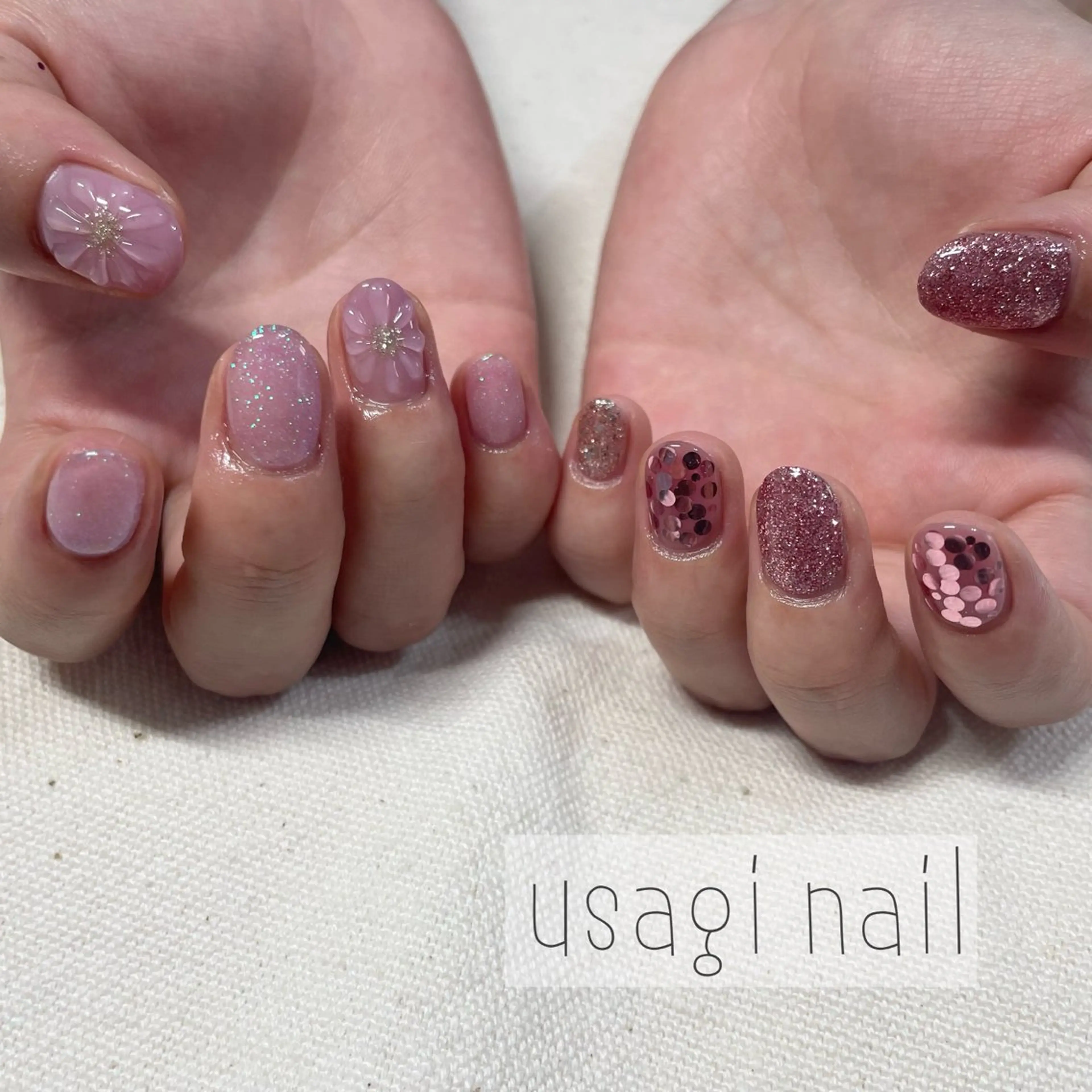 ネイル フラワーネイル キラキラネイル ピンク ぷっくりネイル usagi nailのネイルデザイン