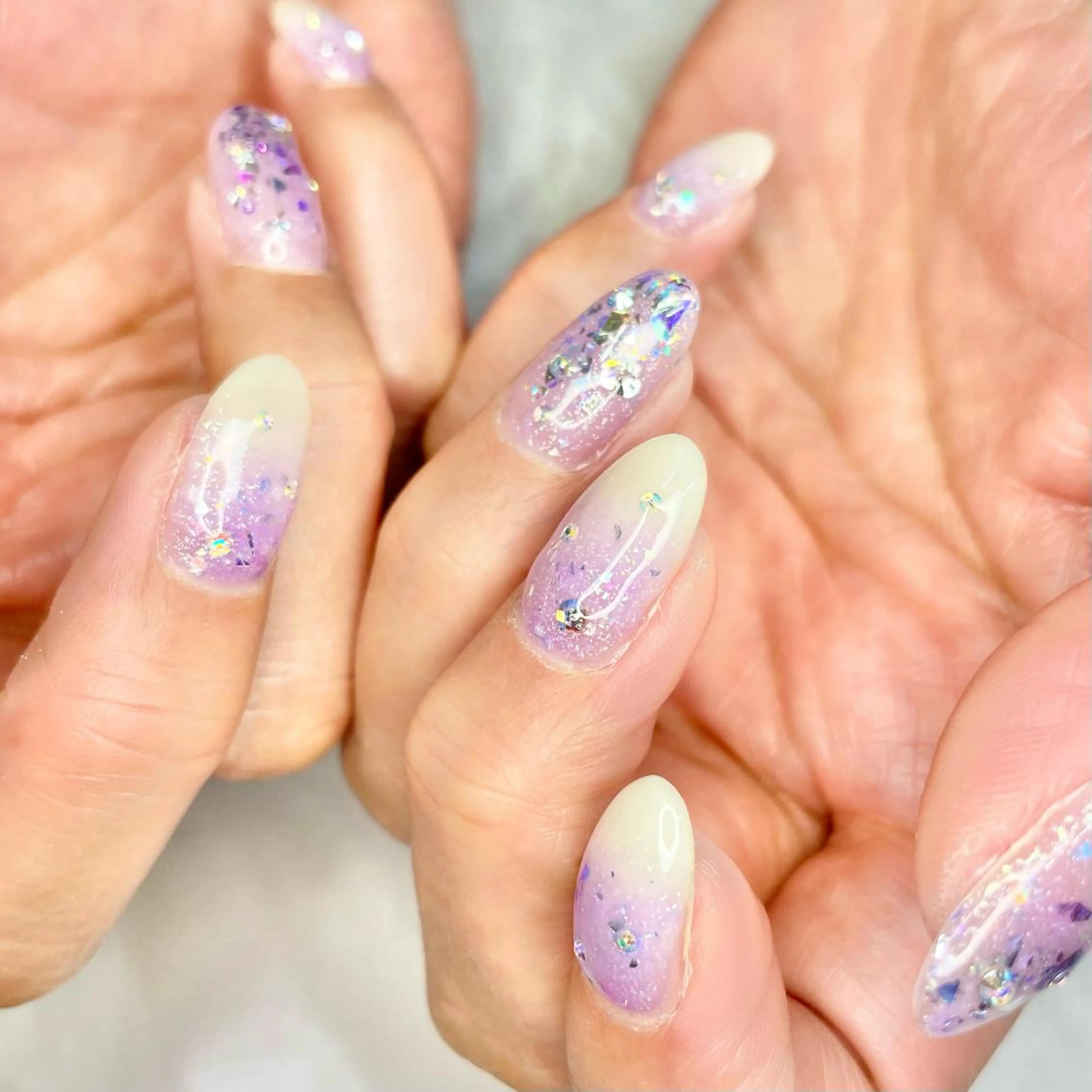 ショート ネイル パープルカラー グラデーション キラキラネイル パープル Reflection marikoのネイルデザイン