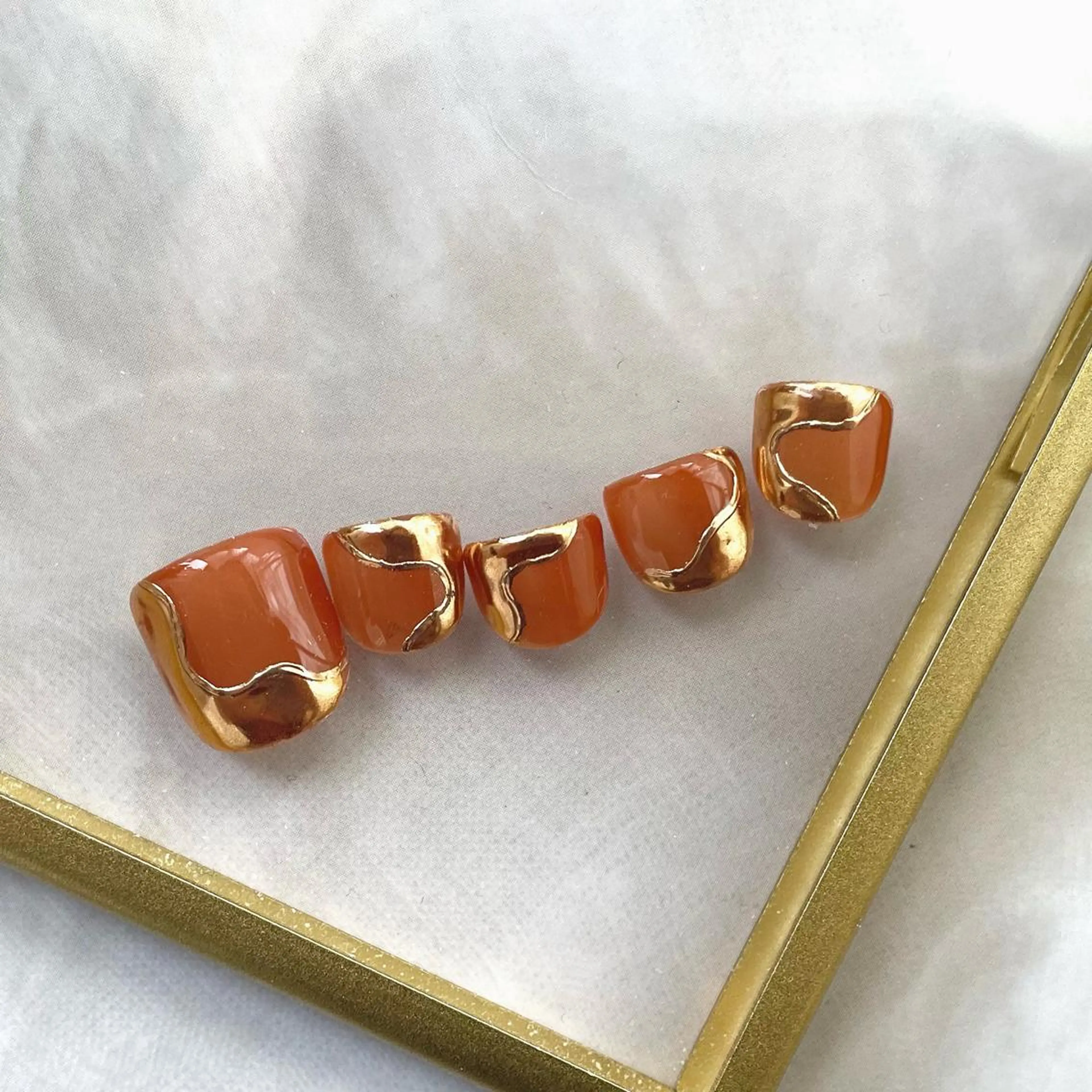 ネイル オレンジ cachette mのネイルデザイン