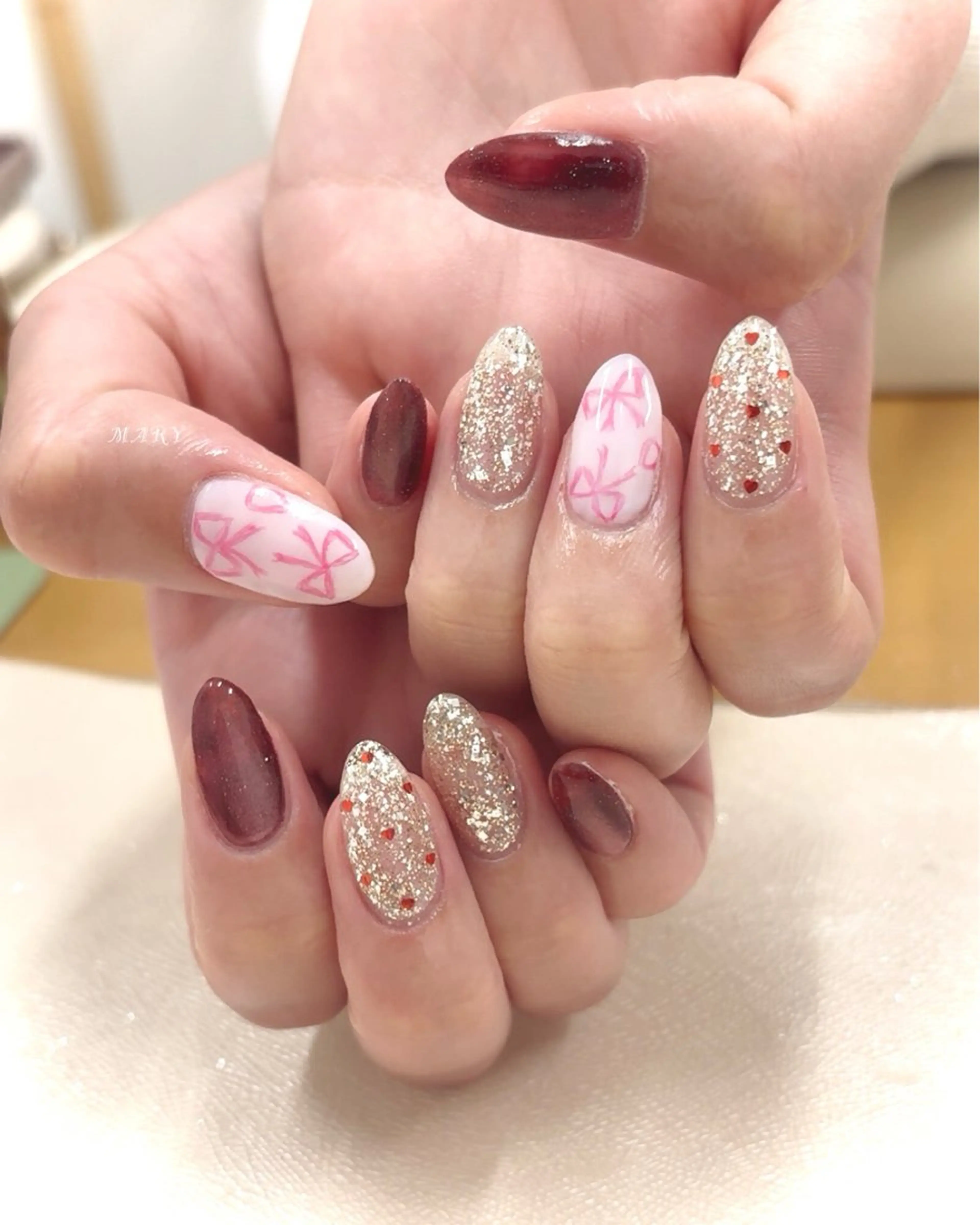 ネイル ボルドー マグネットネイル ニュアンスネイル リボン ハンドネイル Mary nail所属・Mary nail .narumiのネイルデザイン