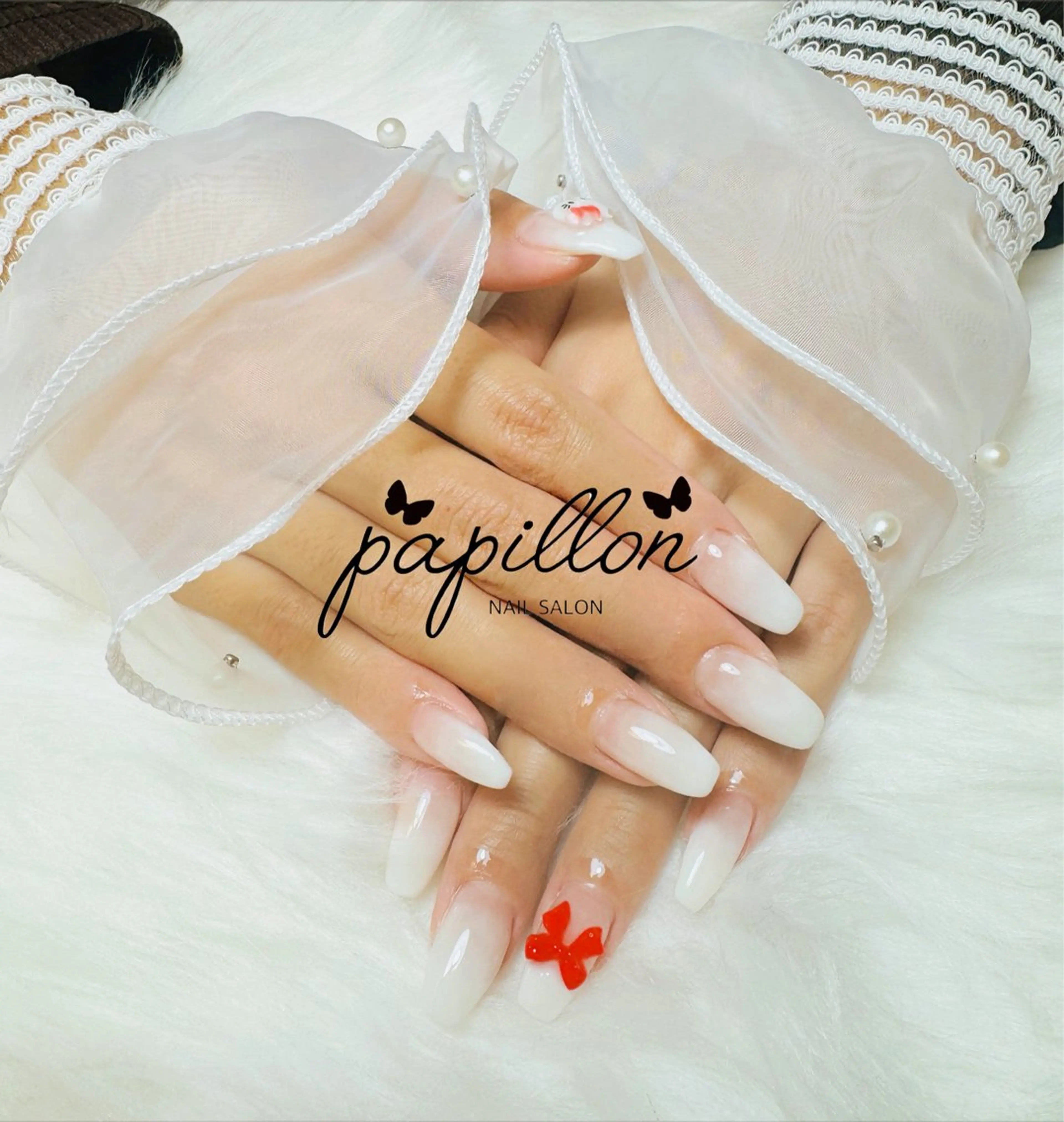 ネイル グラデーション リボン NAILSALON　papillon所属・NAILSALON papillonのネイルデザイン