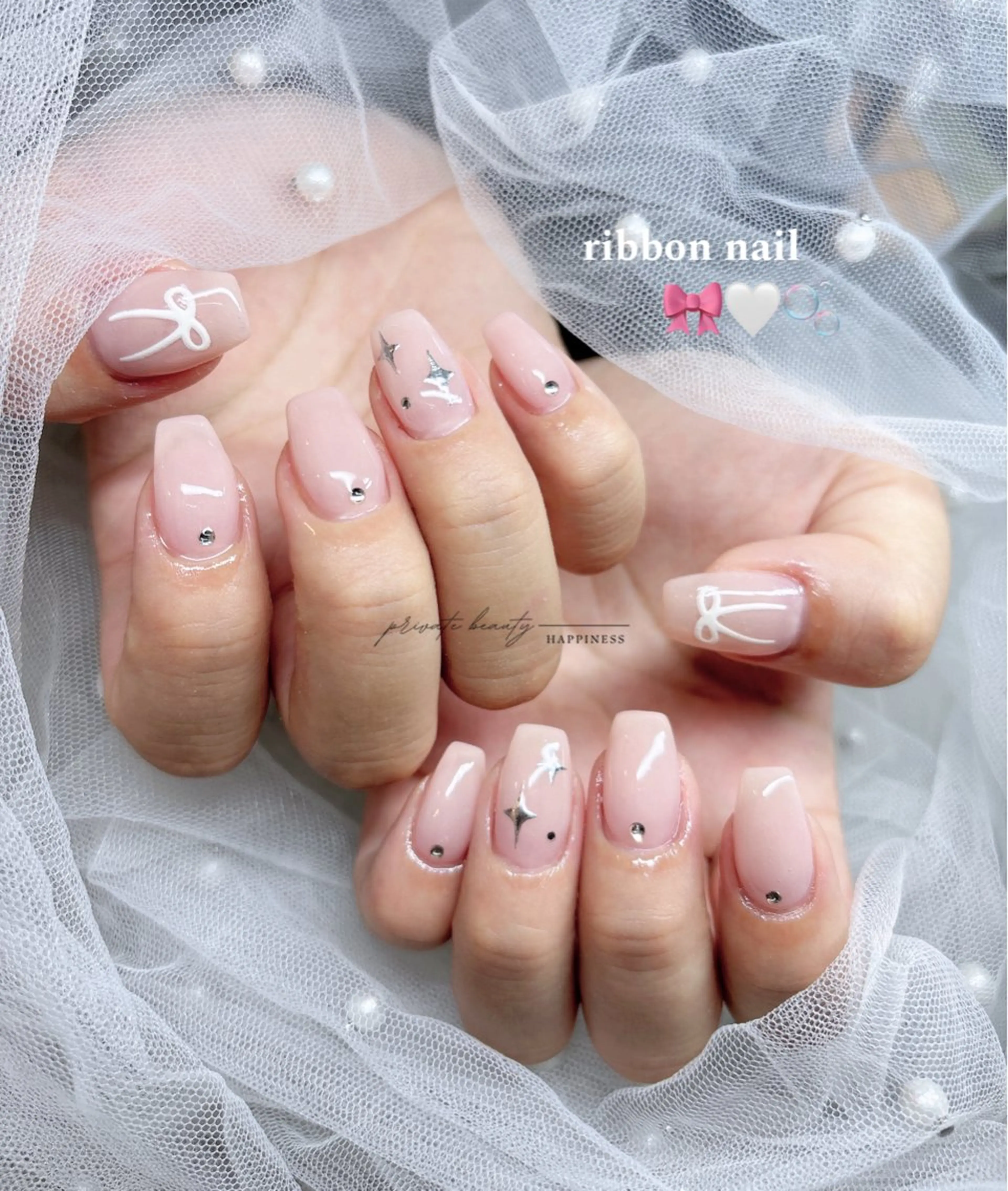ネイル ジェルネイル ロングネイル ピンク リボン ワンホンネイル happiness nailのネイルデザイン