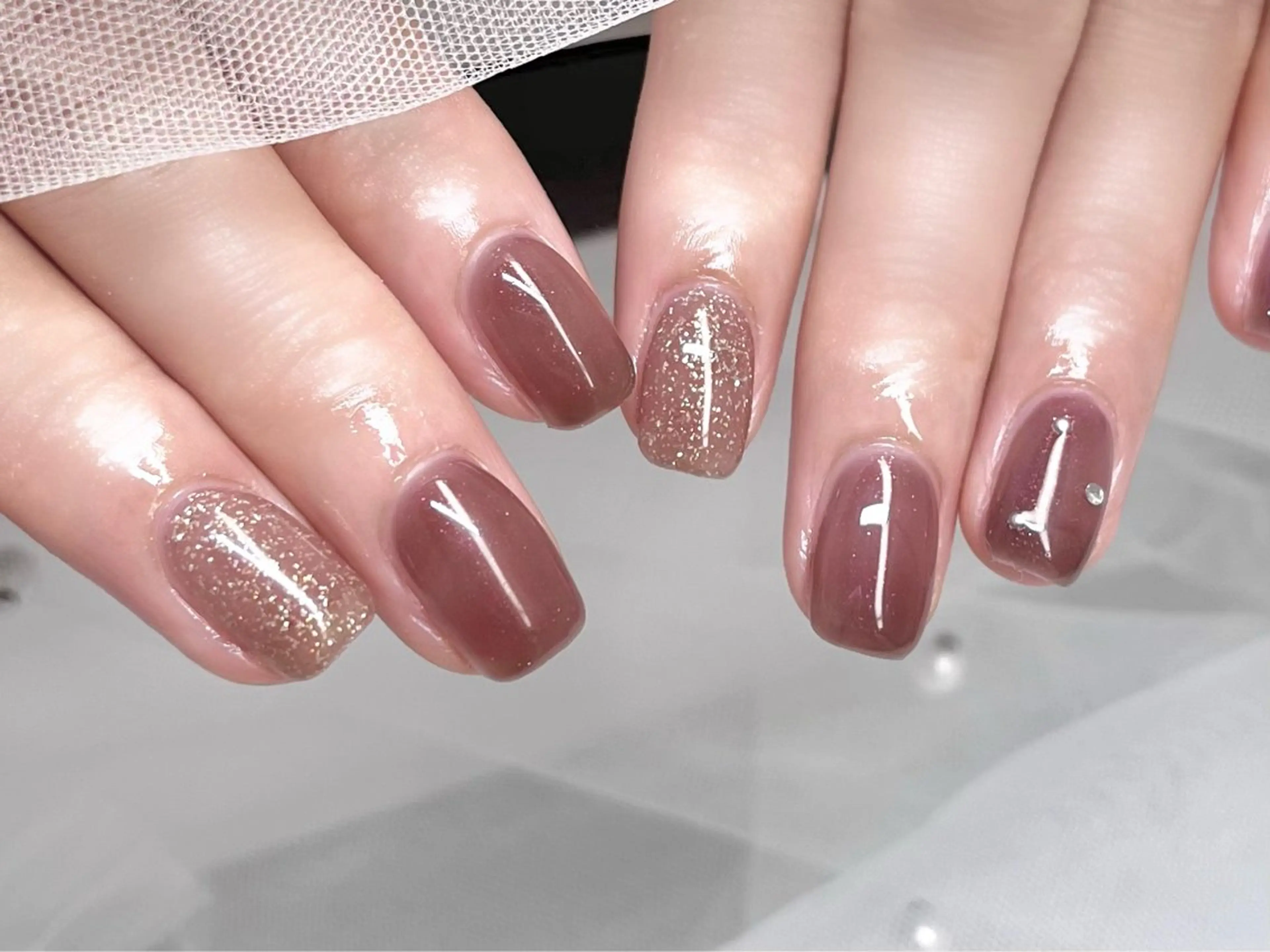 ネイル ブラウン ラメ(グリッター) LORAN  Lim EYE&NAIL【ローランリム】所属・LORAN Lim 紫月のネイルデザイン