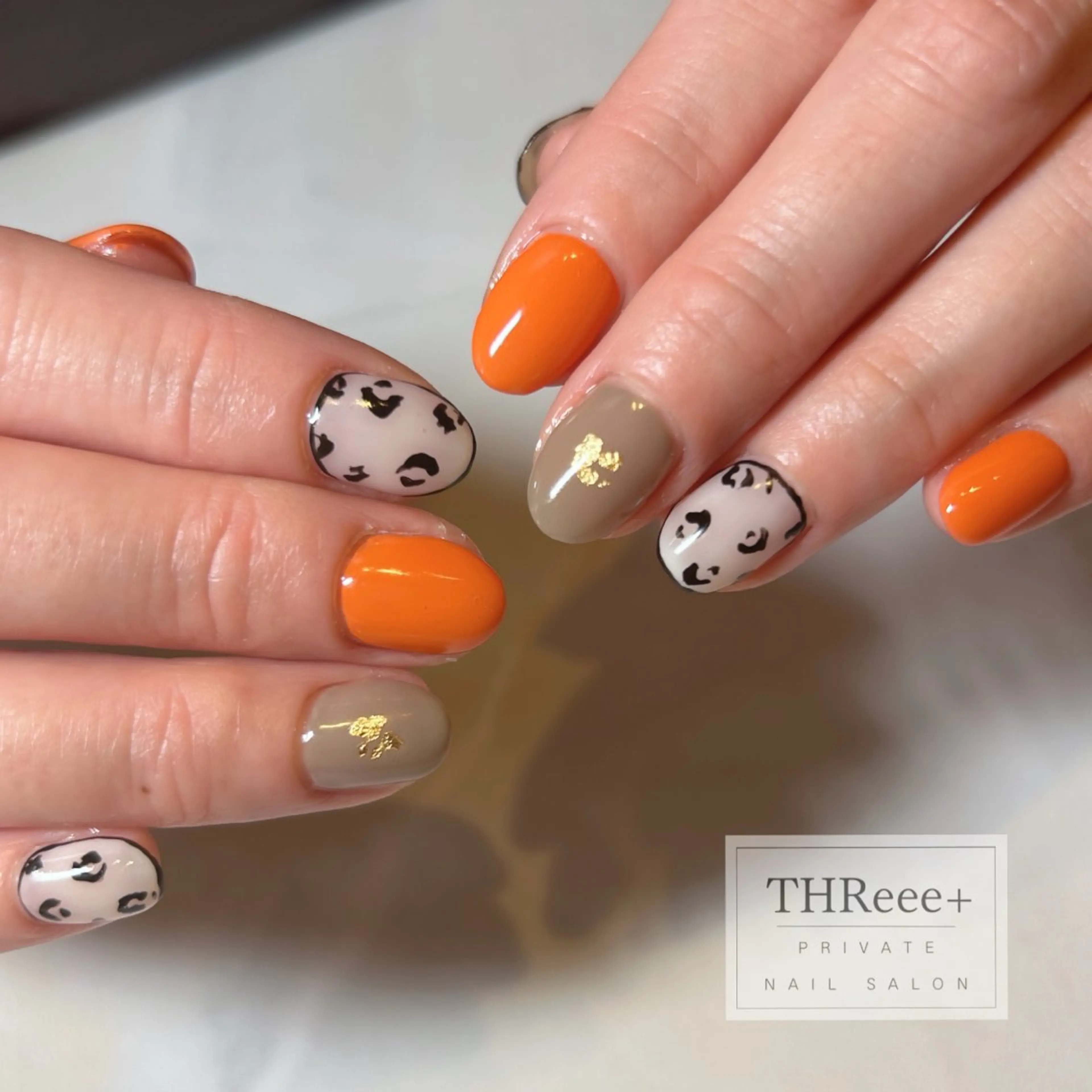 ネイル オレンジ THReee+ ericoのネイルデザイン
