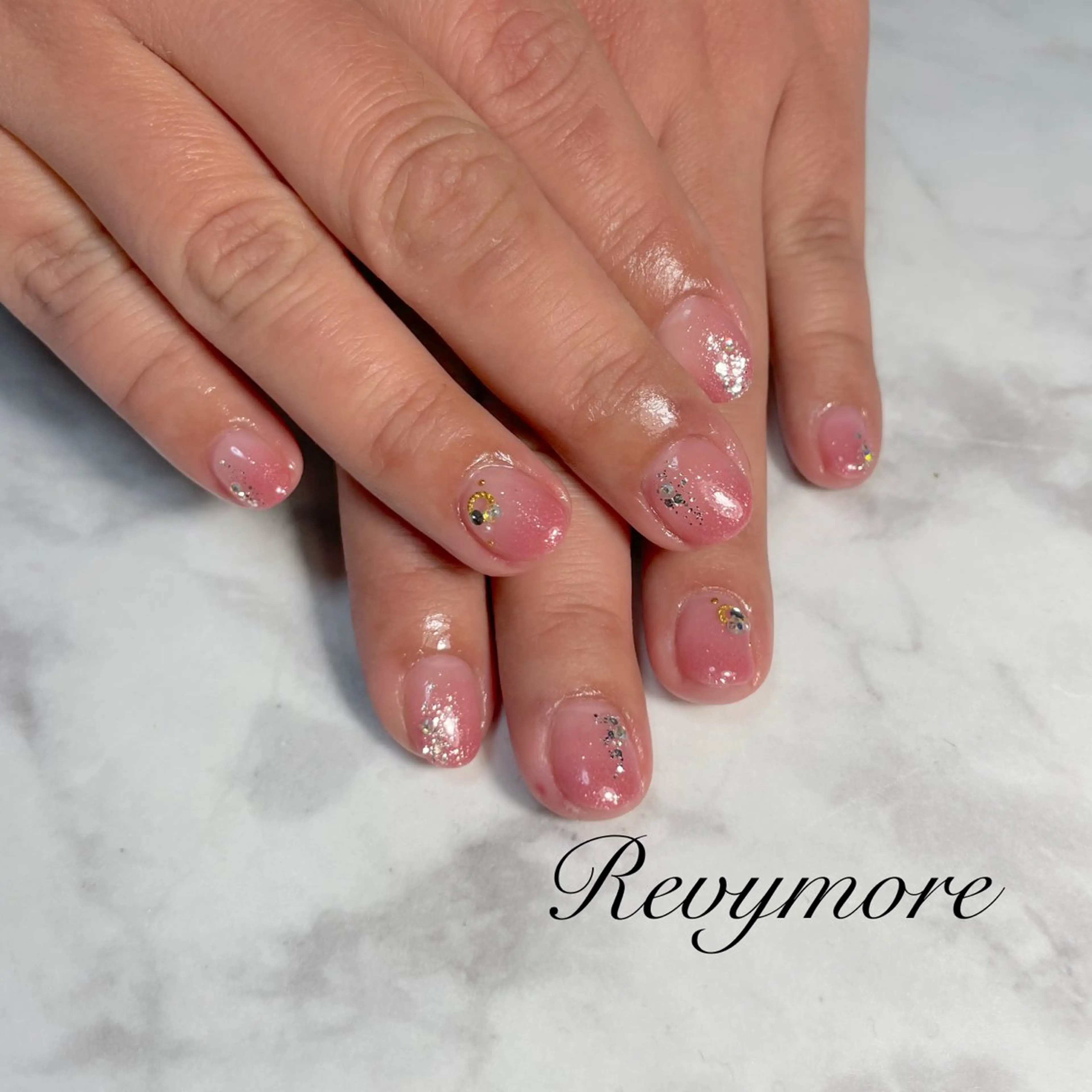ネイル 桜ネイル 入学式 ジェルネイル キラキラネイル 韓国ネイル nail salon Revymore所属・nail salon Revymoreのネイルデザイン