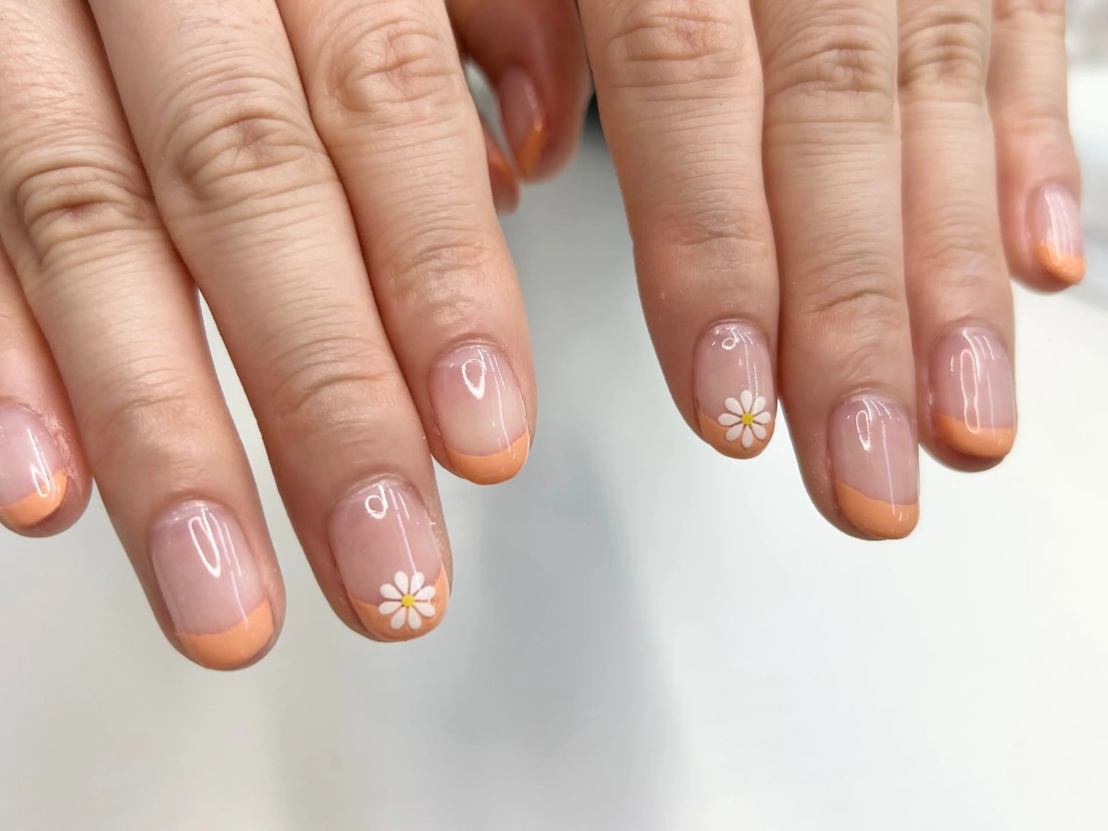 ネイル 桜ネイル フラワーネイル フレンチネイル オレンジ 春ネイル ハンドネイル Forca total studio所属・Forca Airaのネイルデザイン