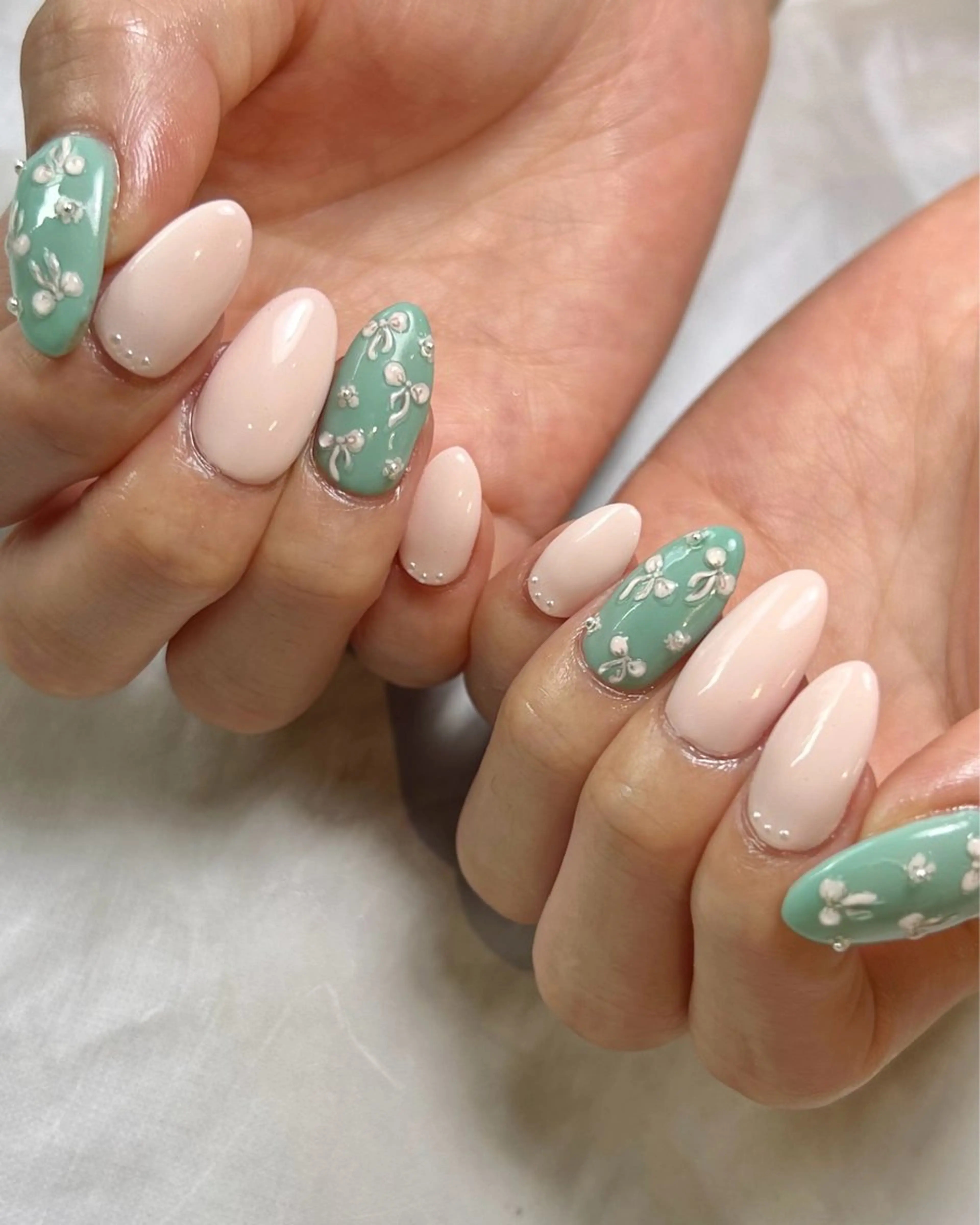 ネイル ガーリー グリーン ピンク リボン ハンドネイル Reflection marikoのネイルデザイン