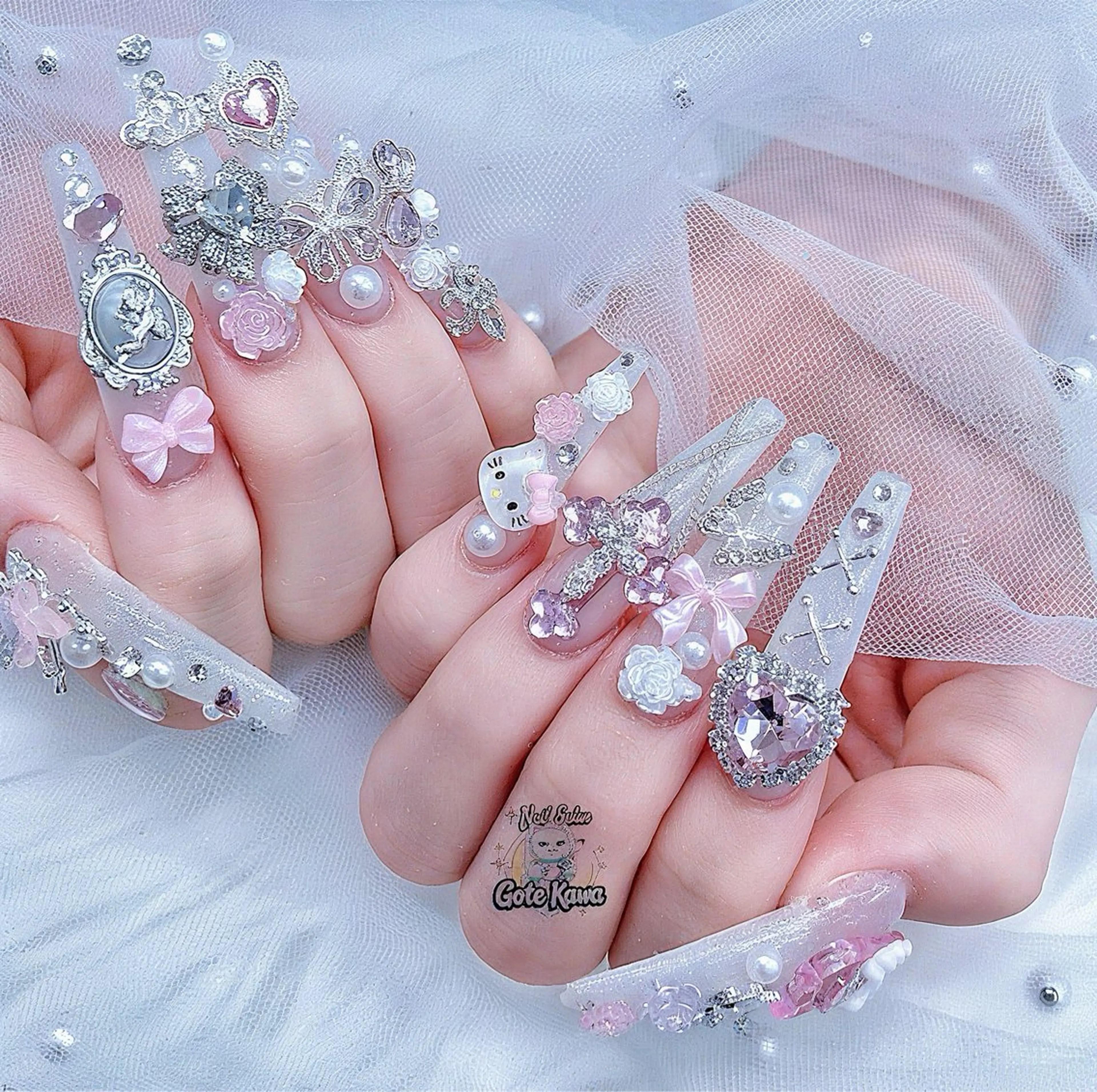 ネイル アートネイル 長さ出し キラキラネイル ピンク リボン ハンドネイル ハンドケア GOTE KAWA Nail Salon(ゴテかわ)所属・Gote Kawa nail salonのネイルデザイン