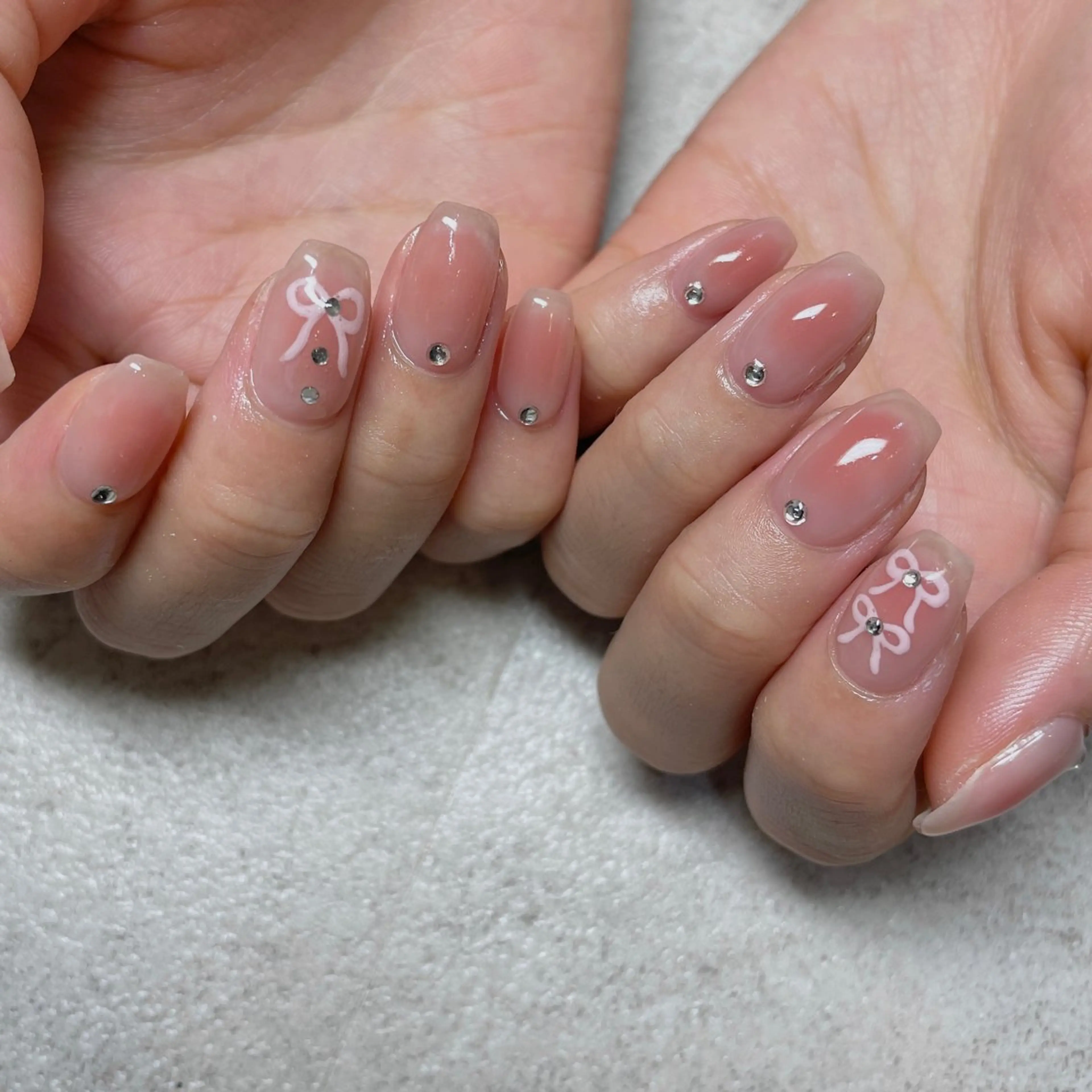 ネイル チークネイル 韓国ネイル オフィスネイル ピンク リボン ハンドネイル acs.n所属・ネイル，耳つぼ 風間すみれのその他イメージ