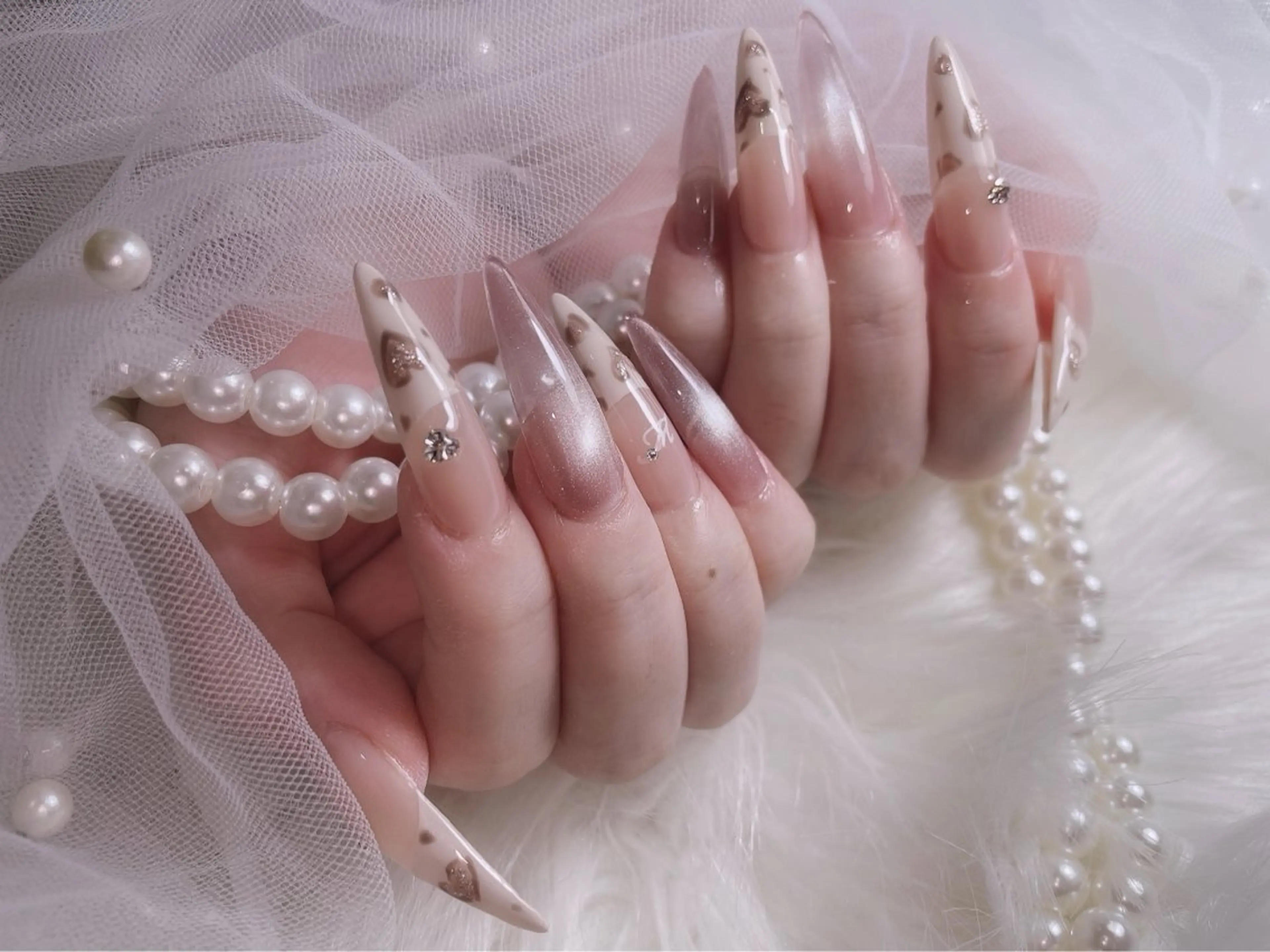 ネイル アニマル柄 ロングネイル マグネットネイル ハンドネイル emu【心斎橋店】 michinaのネイルデザイン