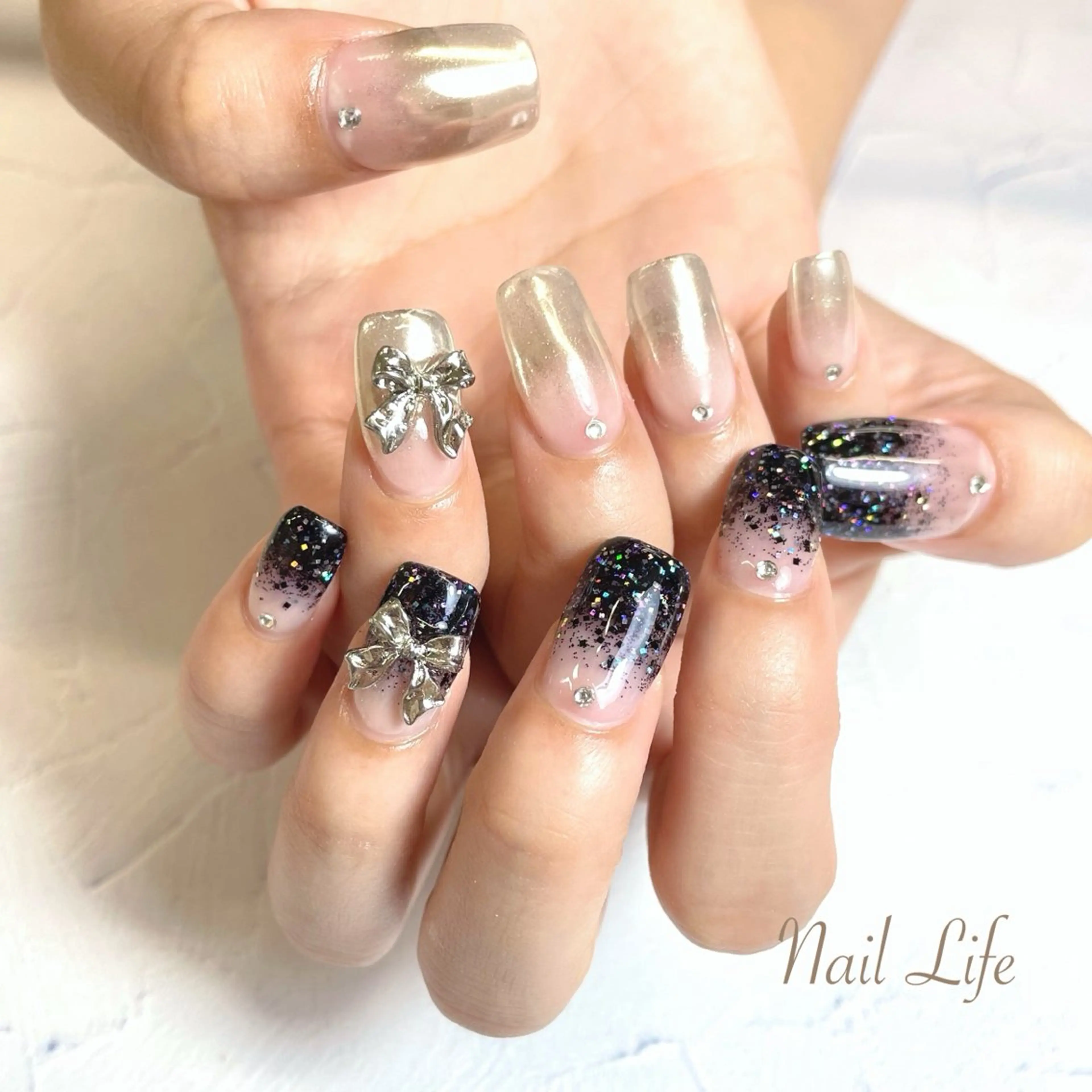 ネイル ミラーネイル リボン 大嶋 めぐみのネイルデザイン