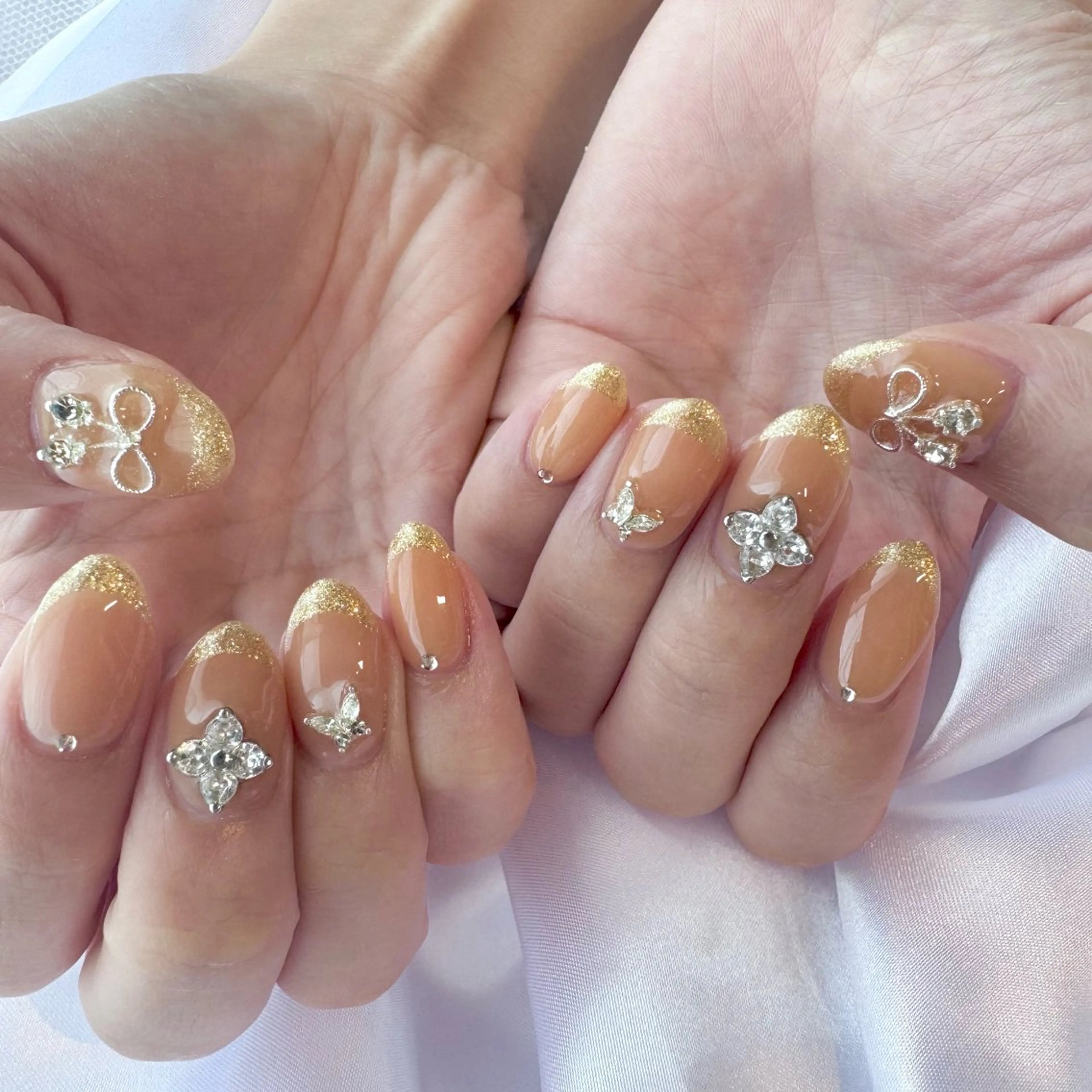 ネイル オレンジ リボン nail salon e'mu💐のネイルデザイン