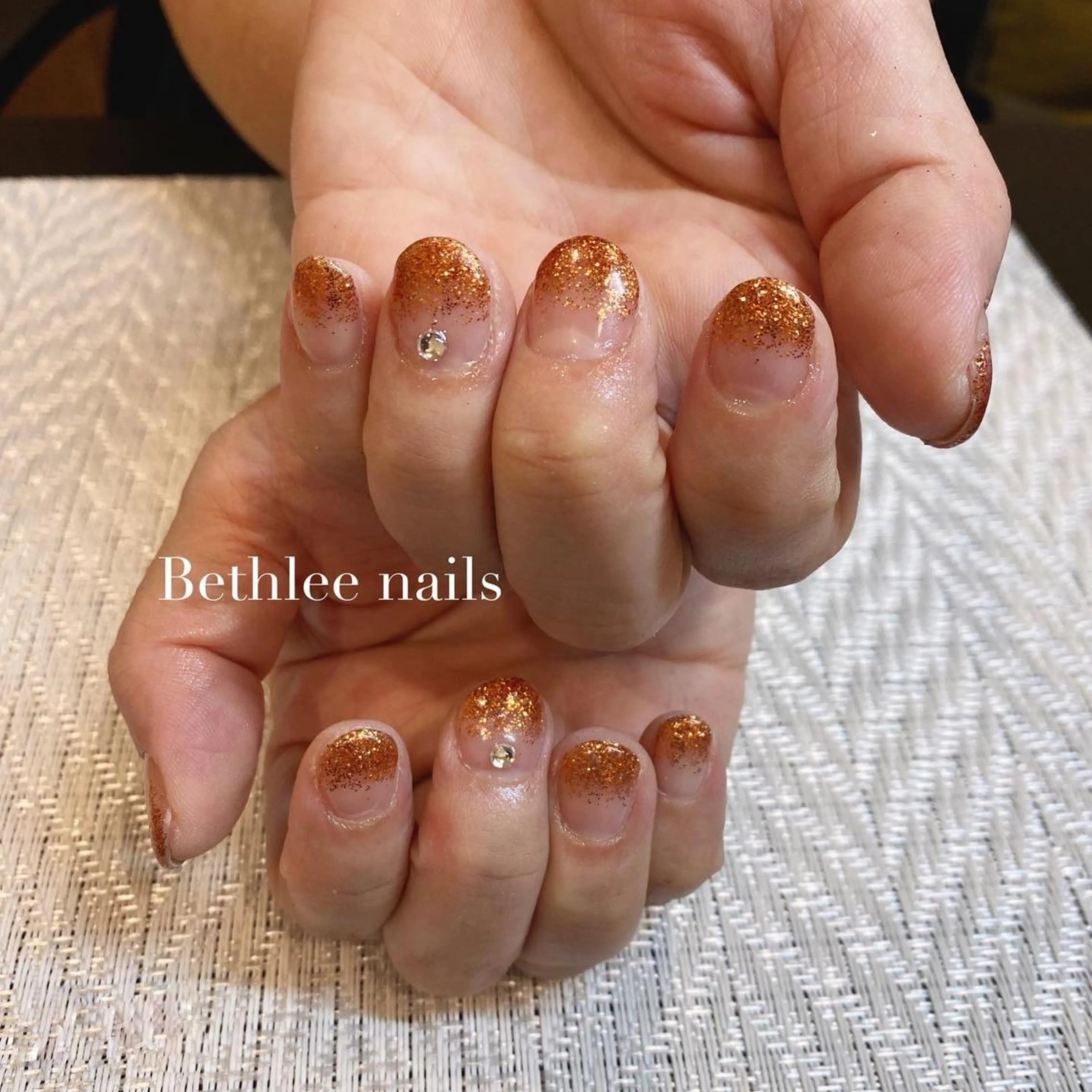 ネイル ラメ(グリッター) ラメグラデーション オレンジ ストーンネイル Bethlee nailsのネイルデザイン