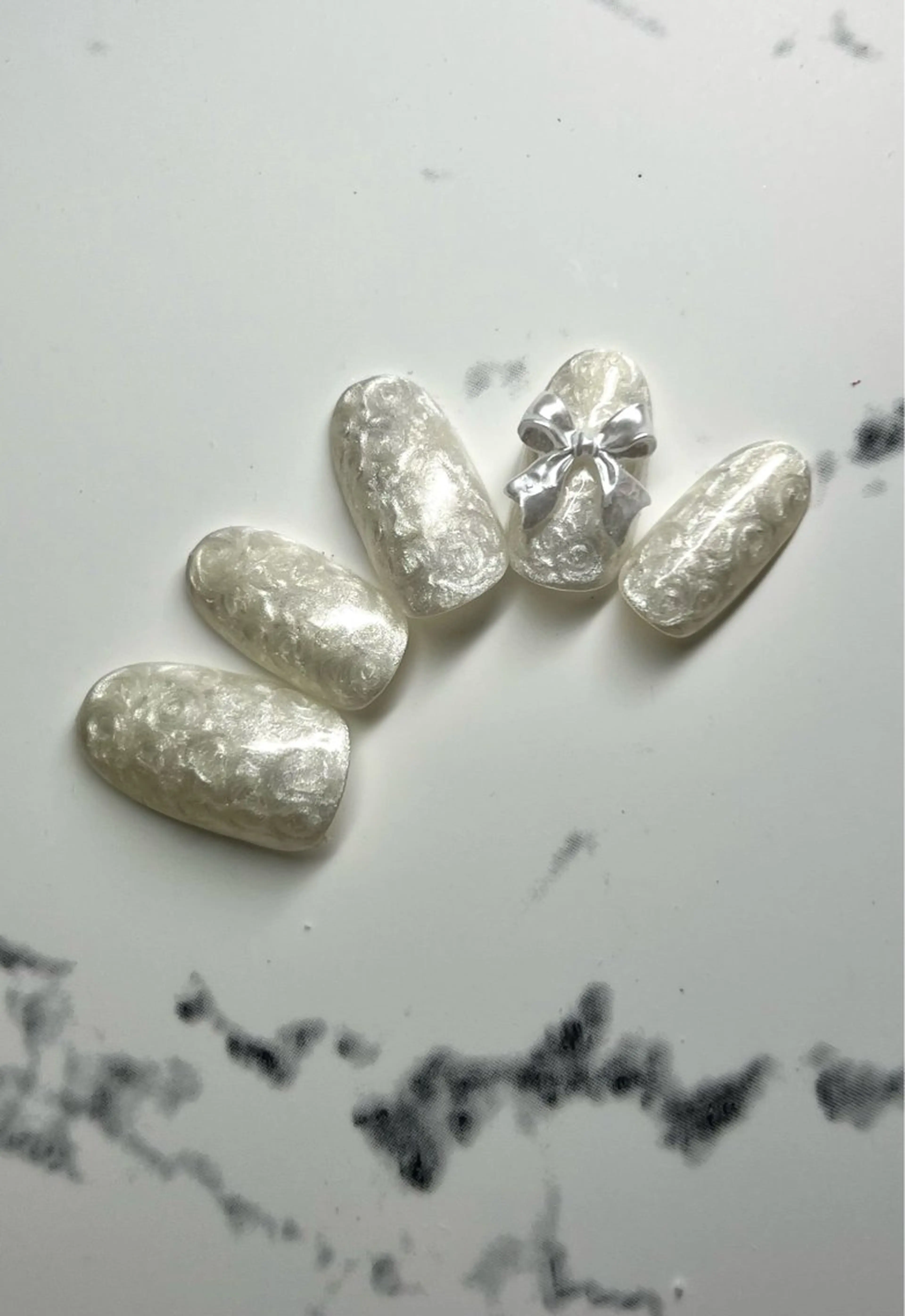 シルクパールネイルにリボン🎀の写真