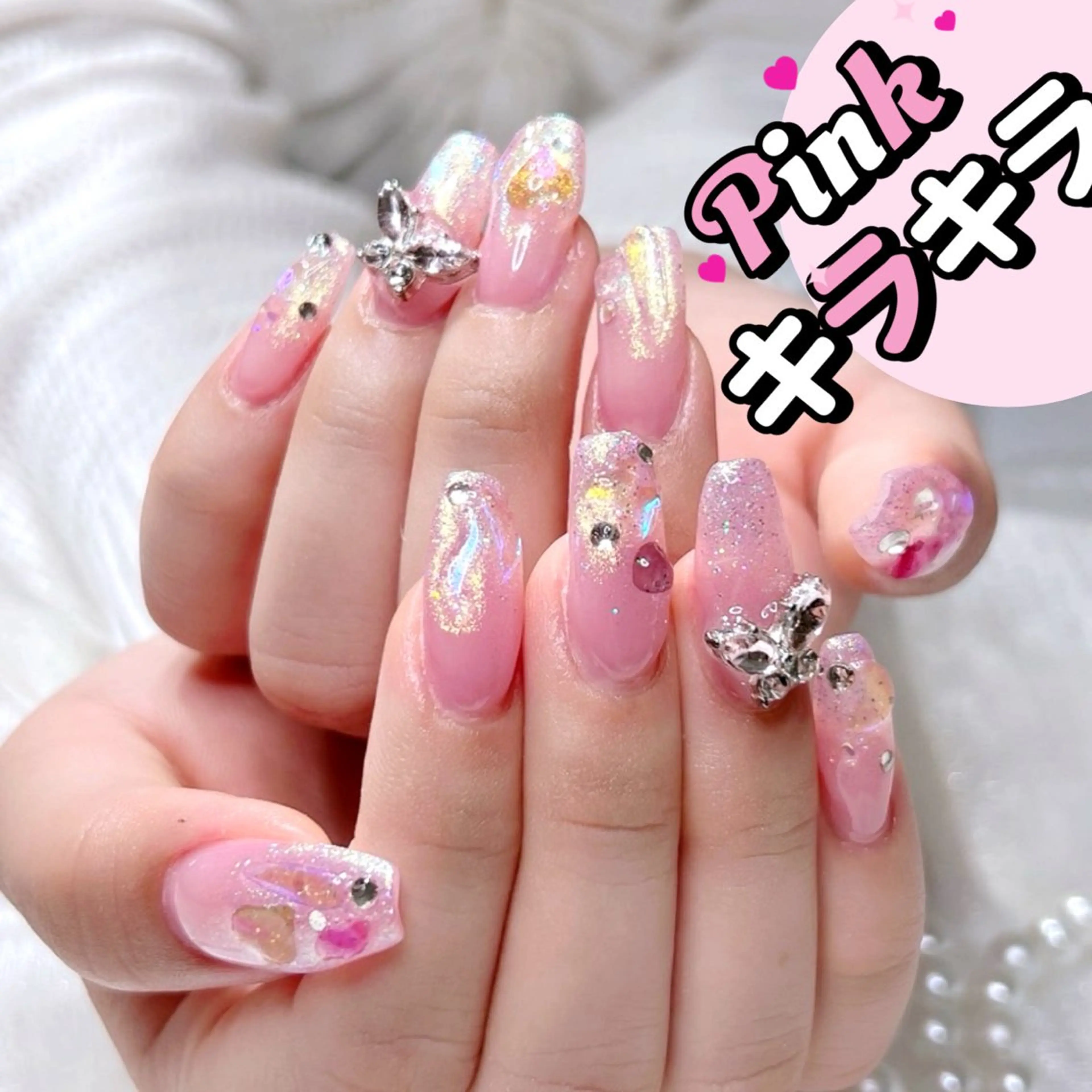 ネイル ピンク リボン、ガーリー パーツ放題専門店のネイルデザイン