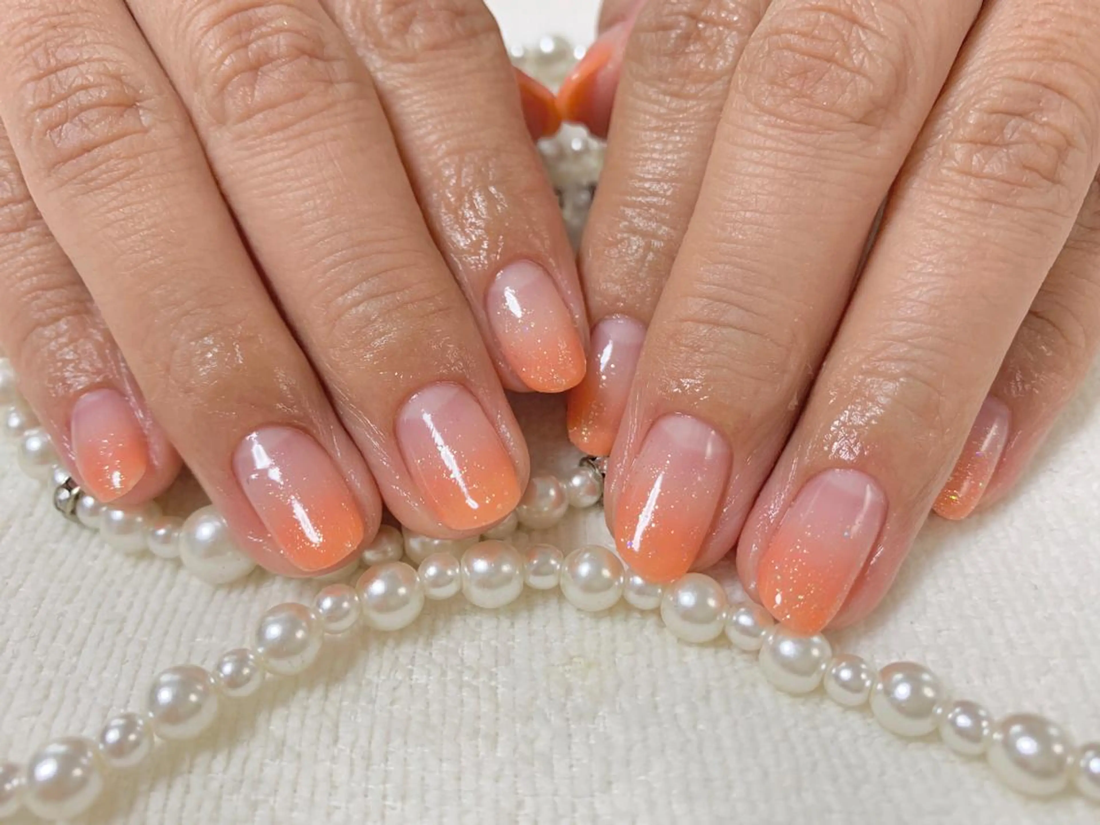 ネイル クリアネイル グラデーション オレンジ 手塚 里奈のネイルデザイン