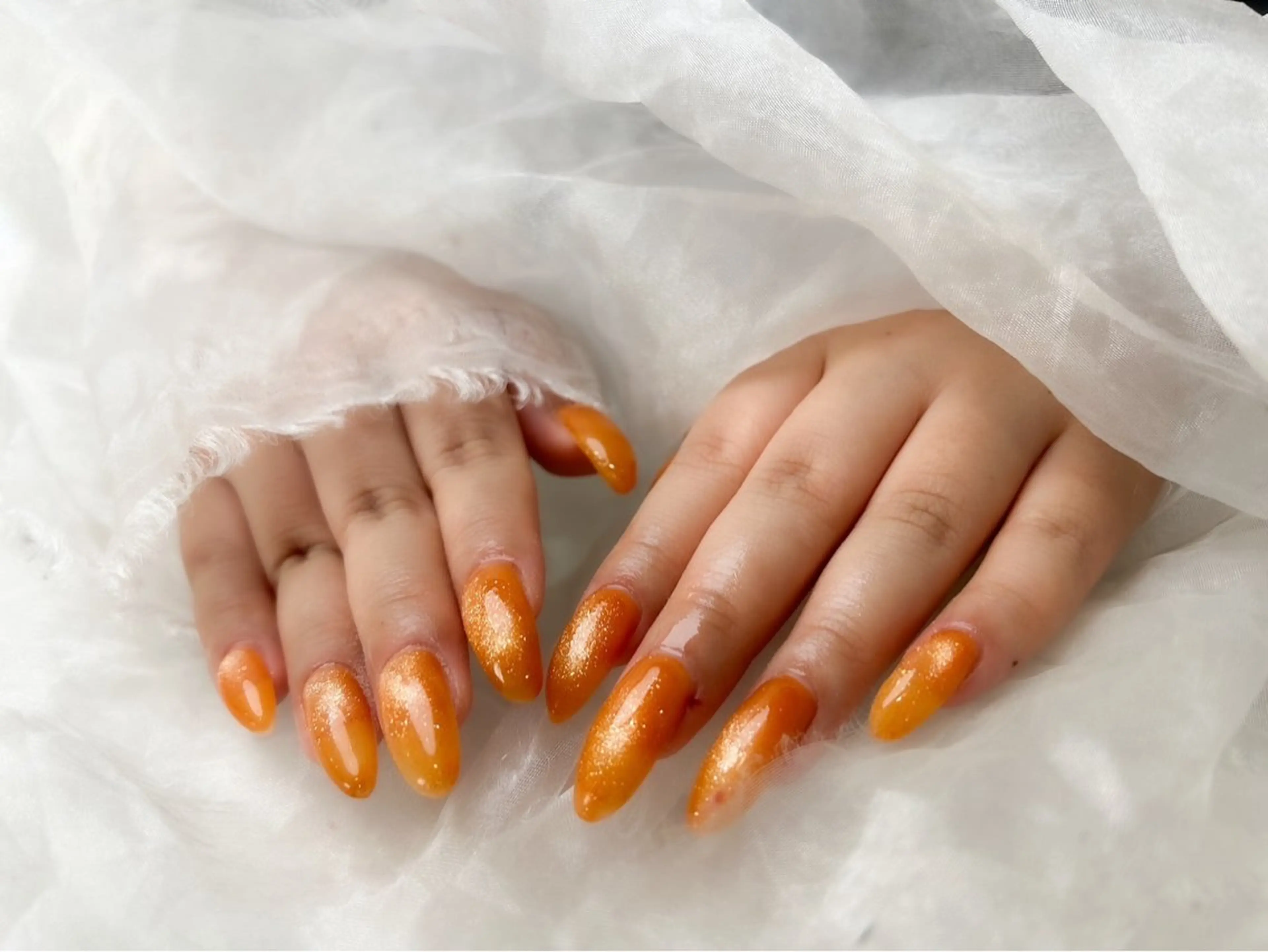 ネイル キラキラネイル マグネットネイル オレンジ thred HONOKAのネイルデザイン