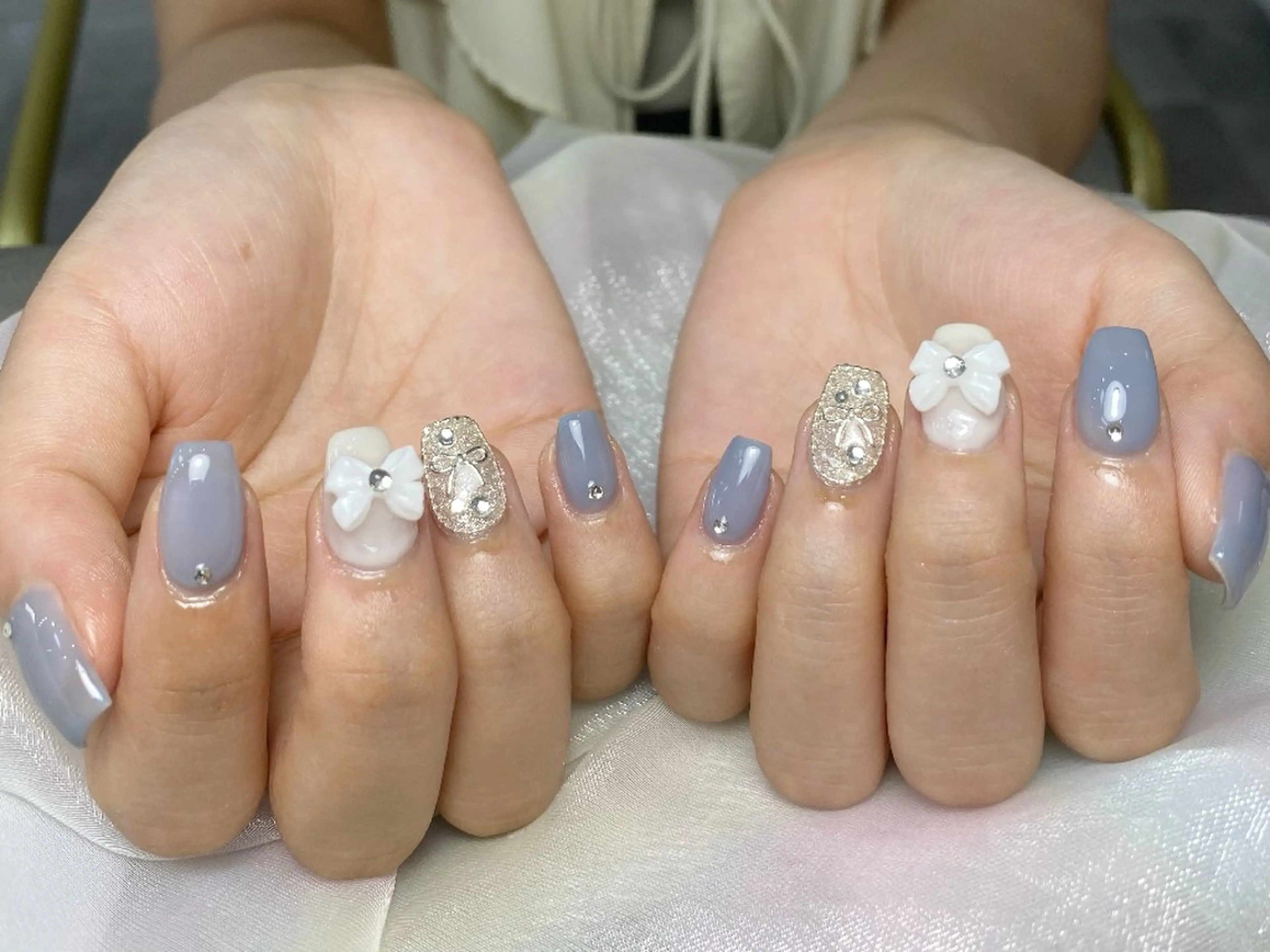 ネイル 水色 持ち込み リボン ワンホンネイル ハンドネイル UM Nail Salonのネイルデザイン