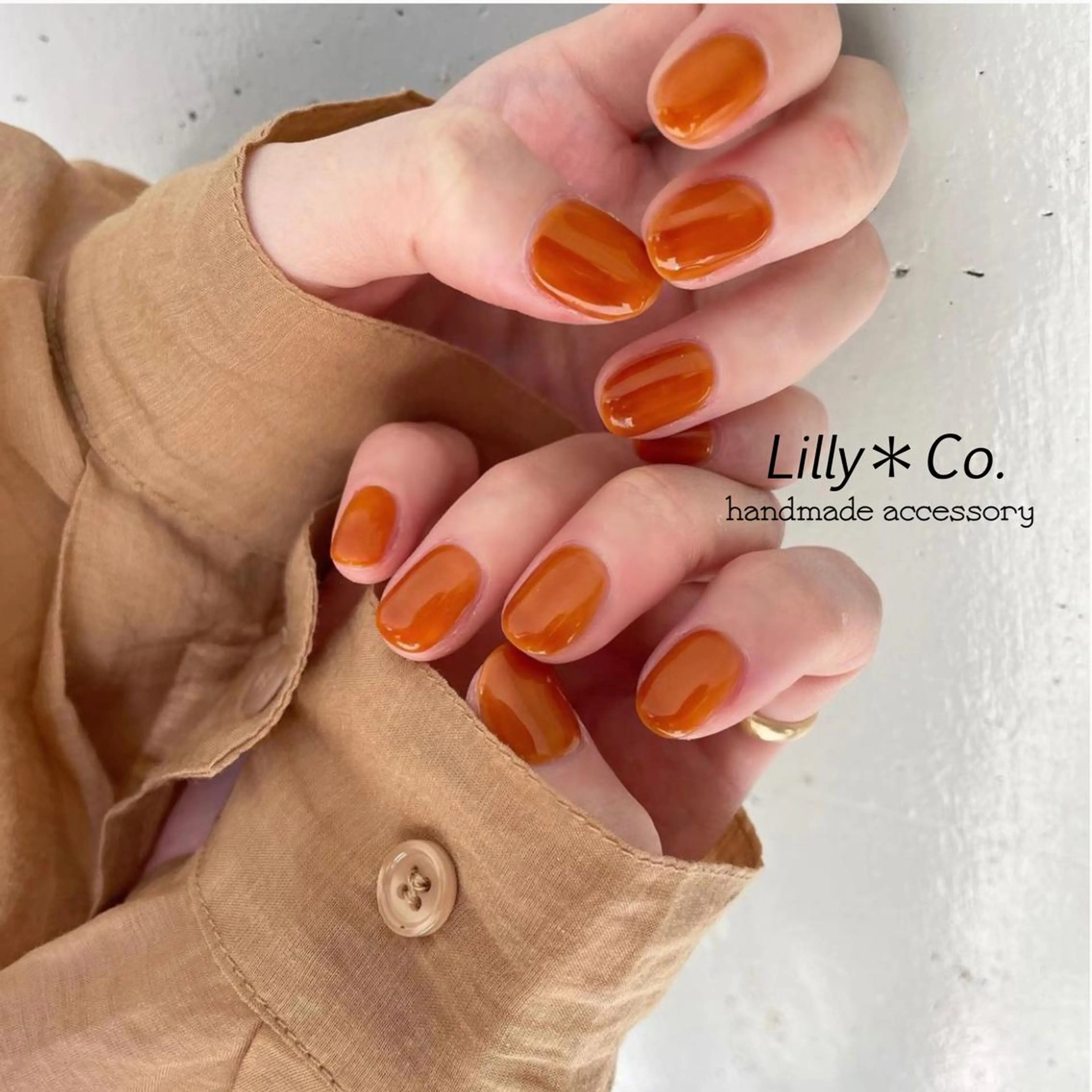 ネイル ワンカラーネイル オレンジ ハンドネイル ハンドケア Lilly Co.のネイルデザイン