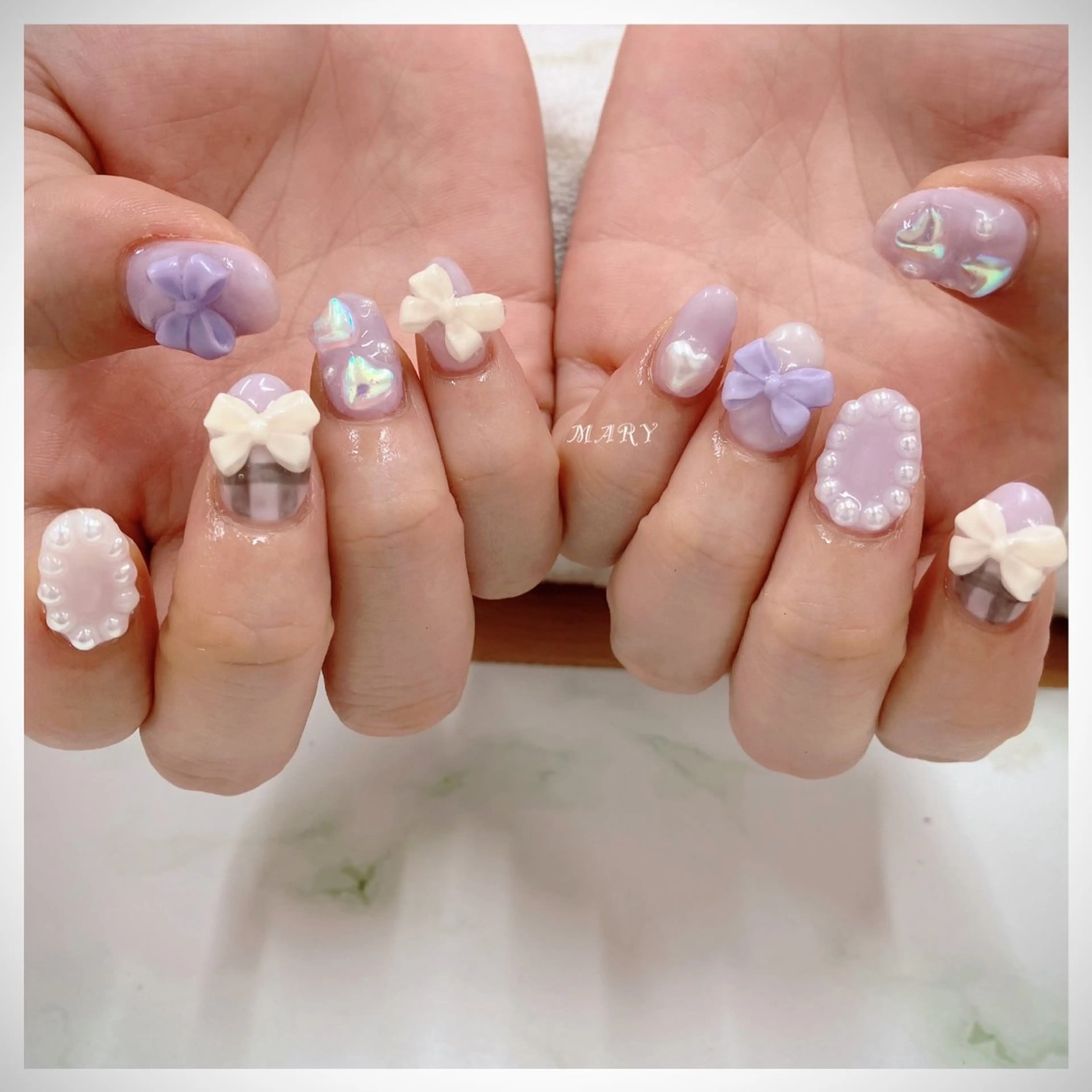 ネイル ニュアンスネイル ワンカラーネイル パープル リボン ハンドネイル Mary nail所属・Mary nail .narumiのネイルデザイン