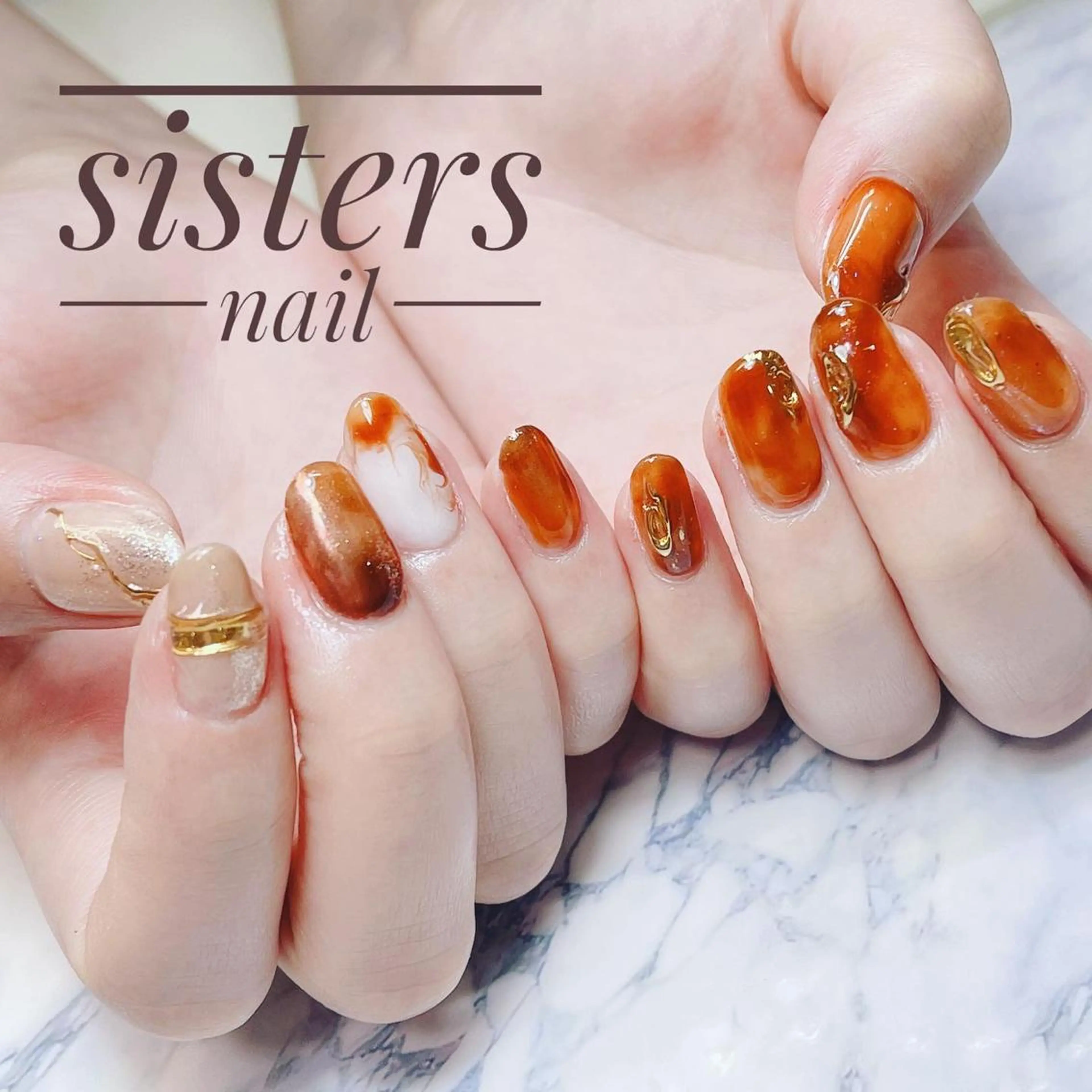 ネイル アートネイル べっ甲ネイル ニュアンスネイル オレンジ sisters nail.fのネイルデザイン
