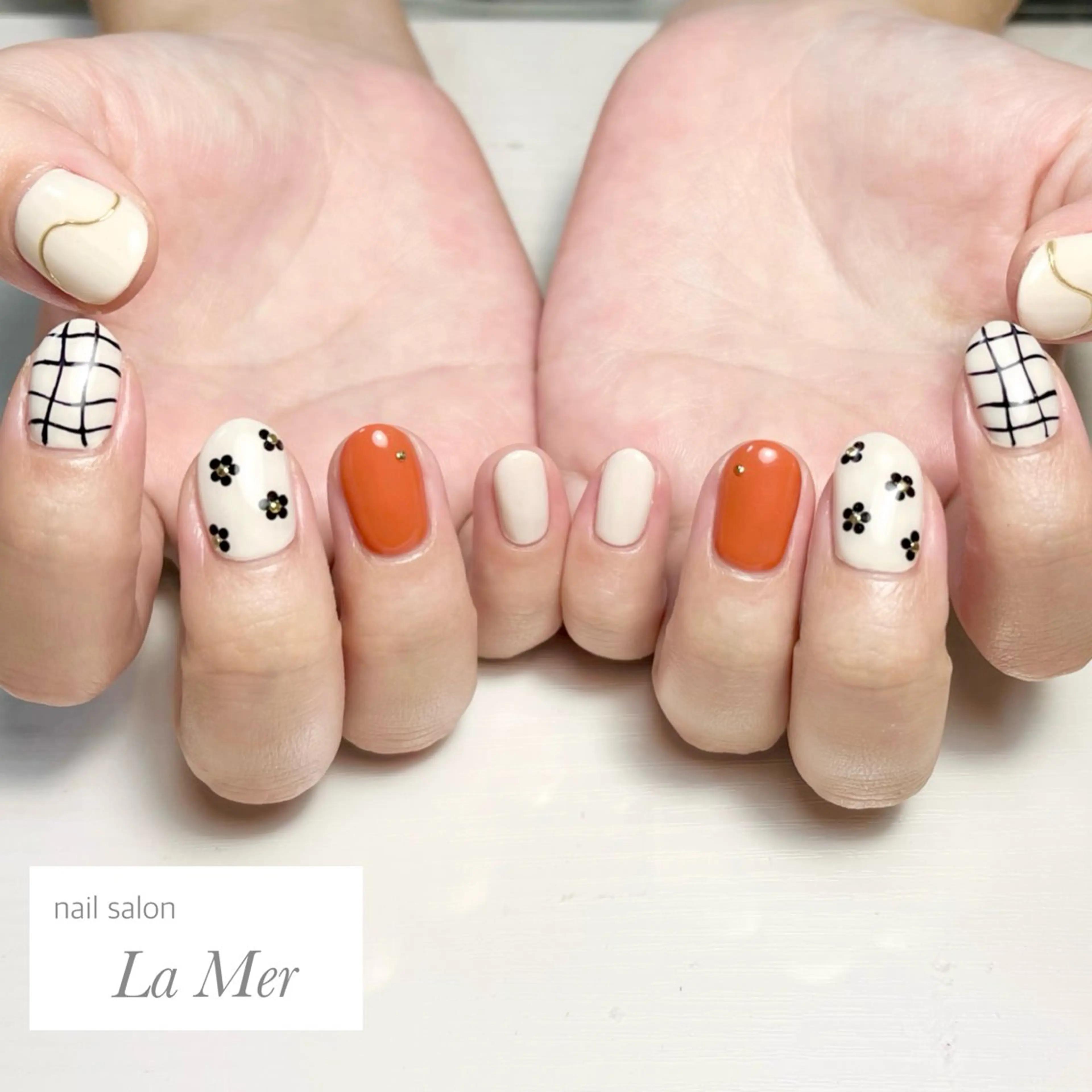 ネイル フラワーネイル 韓国ネイル オレンジ 夏ネイル ハンドネイル nailsalon La Merのネイルデザイン