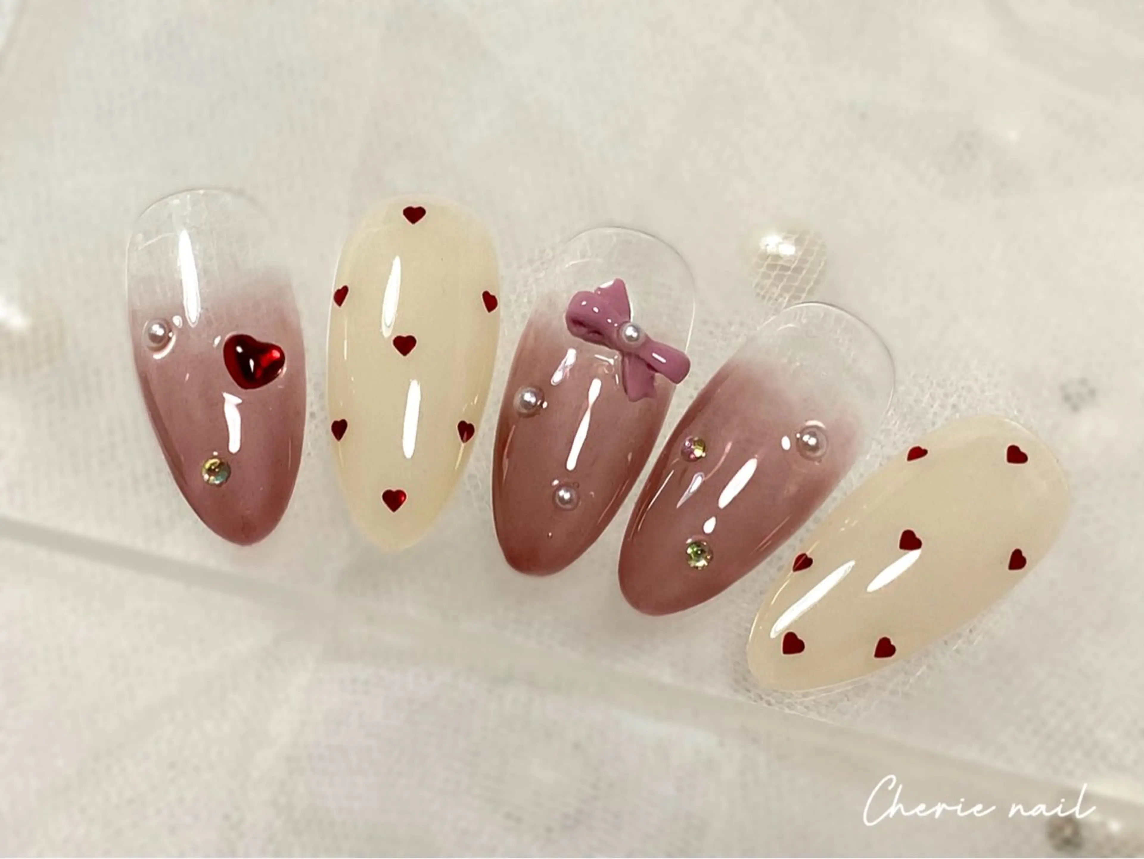 ネイル ジェルネイル ガーリー グラデーション ハート リボン Cherienail yunaのネイルデザイン
