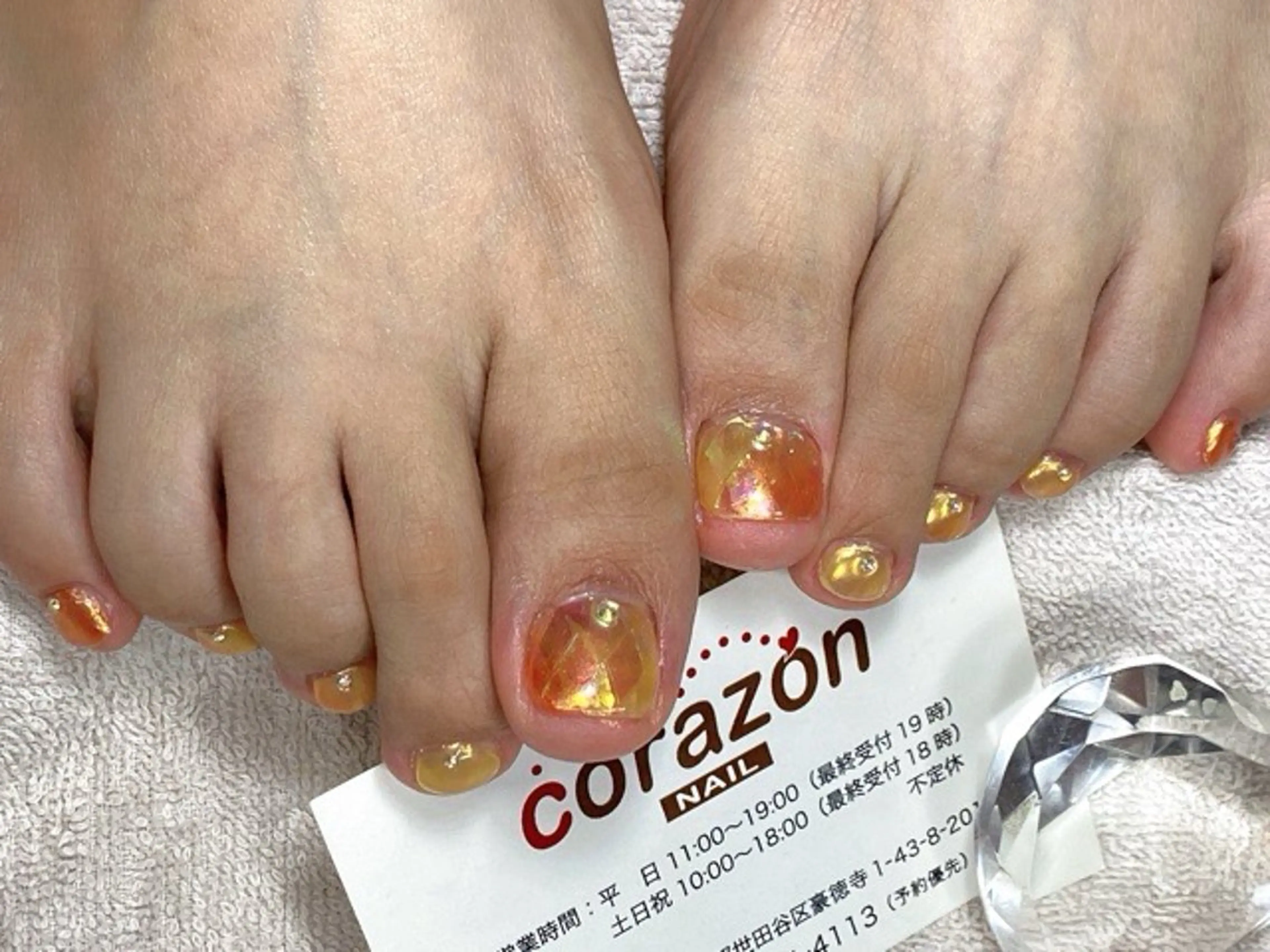 ネイル アートネイル フットネイル グラデーション 氷ネイル・うるうるネイル オレンジ フットネイル corazon所属・ネイリスト aicoのネイルデザイン