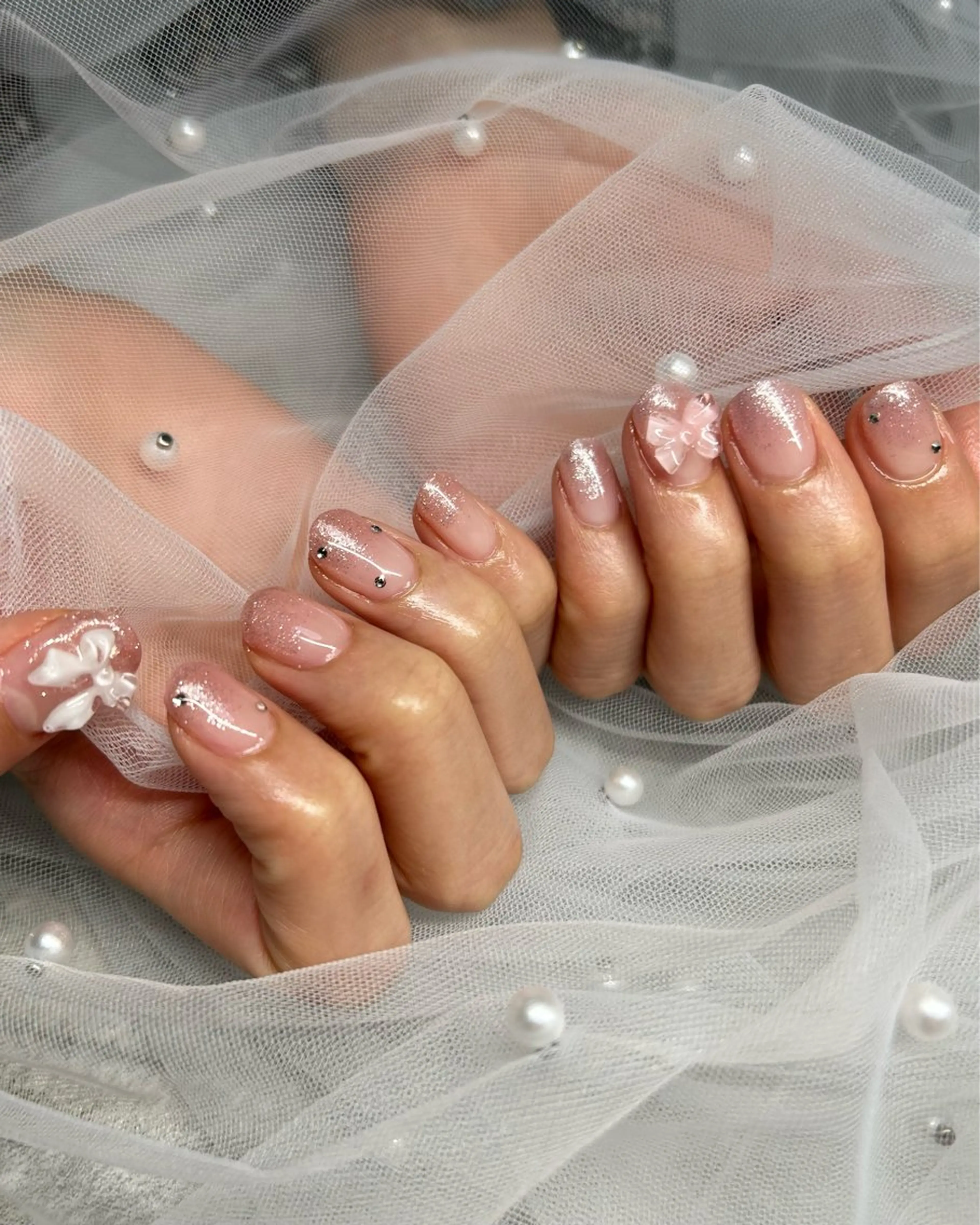 ネイル 氷ネイル・うるうるネイル キラキラネイル リボン ストーンネイル ハンドネイル ten nail salon　かえでのネイルデザイン