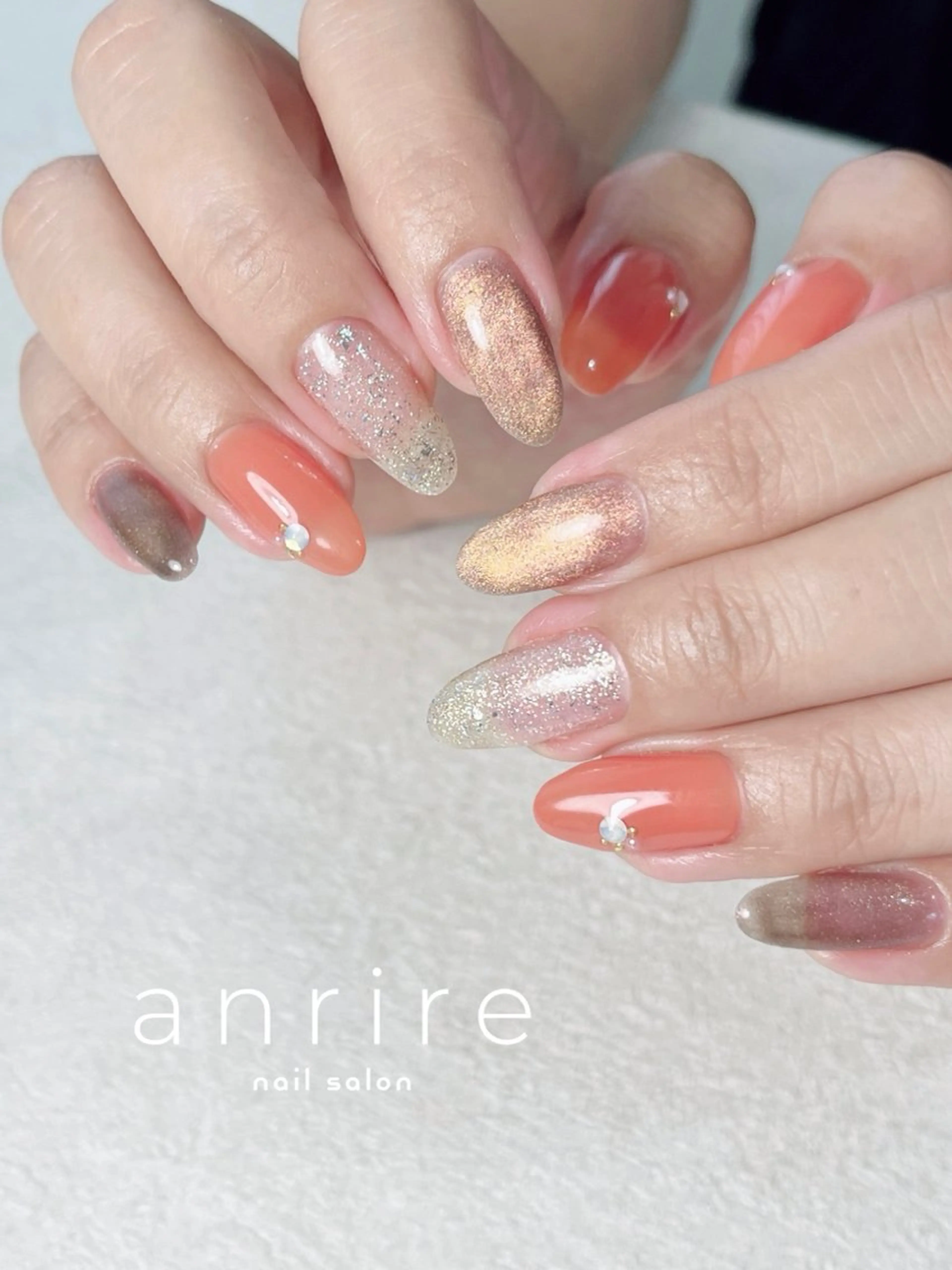 ネイル ジェルネイル キラキラネイル ラメ(グリッター) マグネットネイル オレンジ ハンドネイル nail salon anrire〜アンリール〜所属・nailsalon anrireのネイルデザイン