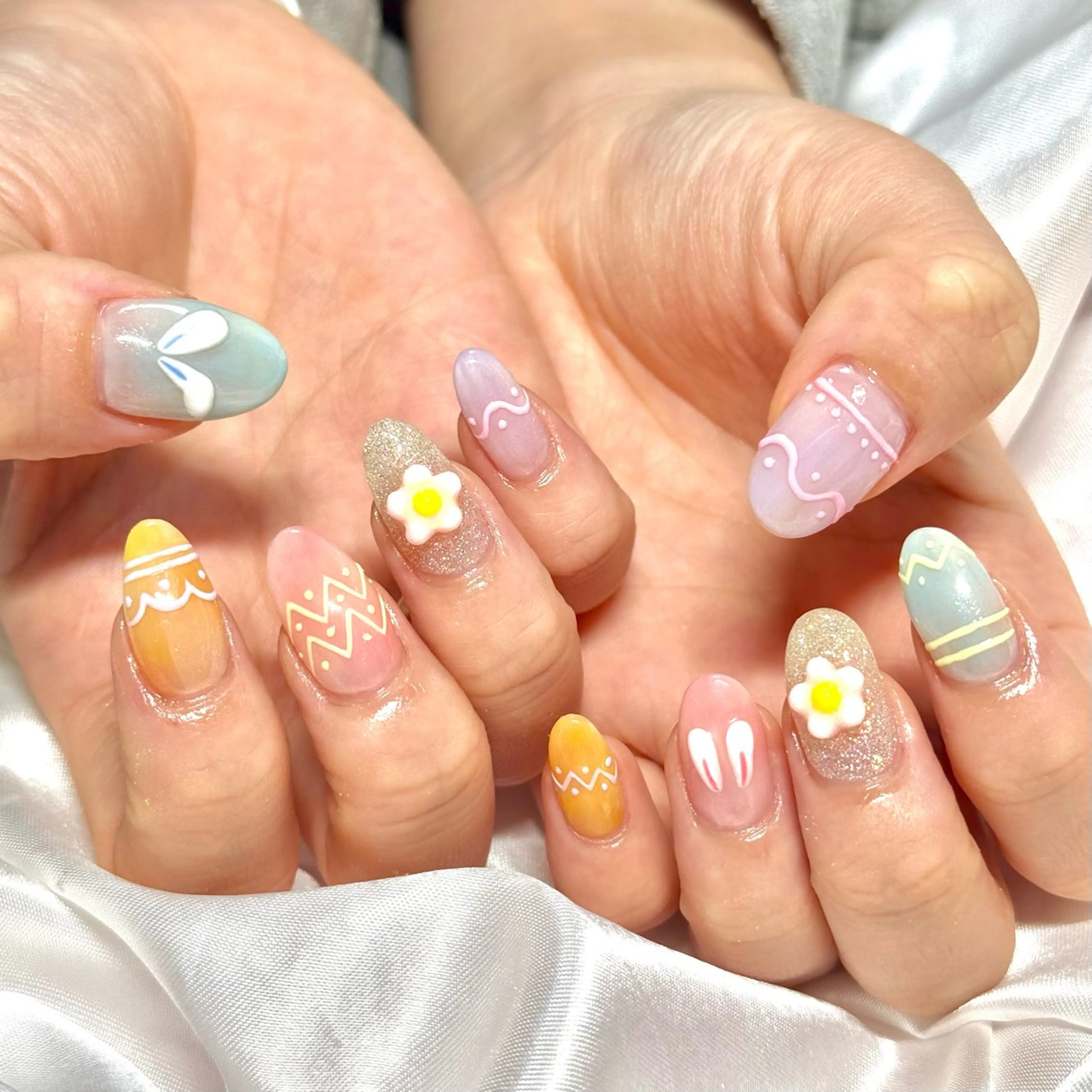 ネイル イースター フラワーネイル パステルネイル ピンク 春ネイル ハンドネイル OKIKA所属・【OKIKA】 らん🦖🌈🧡のマツエク・マツパデザイン