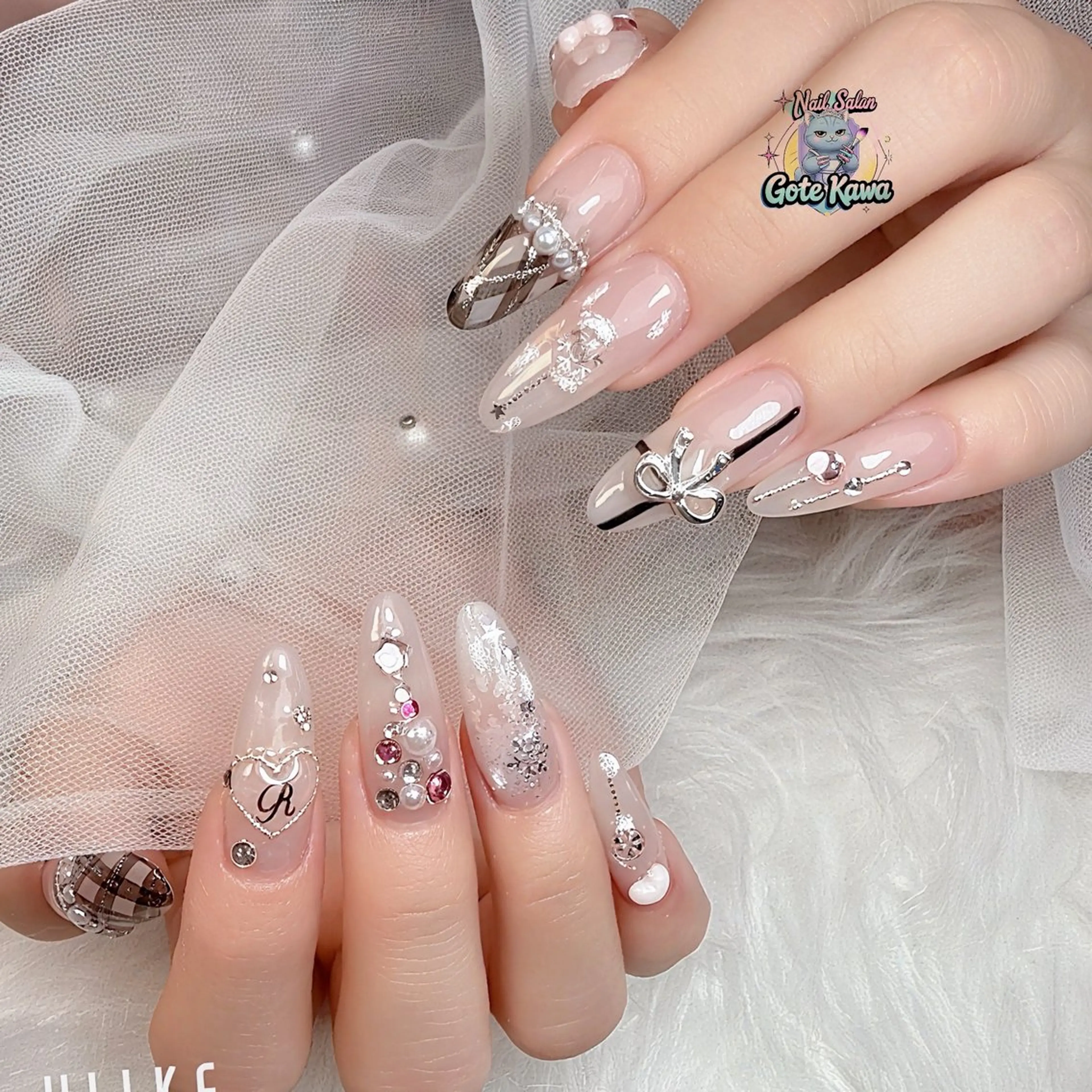 ネイル アートネイル 長さ出し キラキラネイル ピンク リボン ハンドネイル ハンドケア GOTE KAWA Nail Salon(ゴテかわ)所属・Gote Kawa nail salonのネイルデザイン