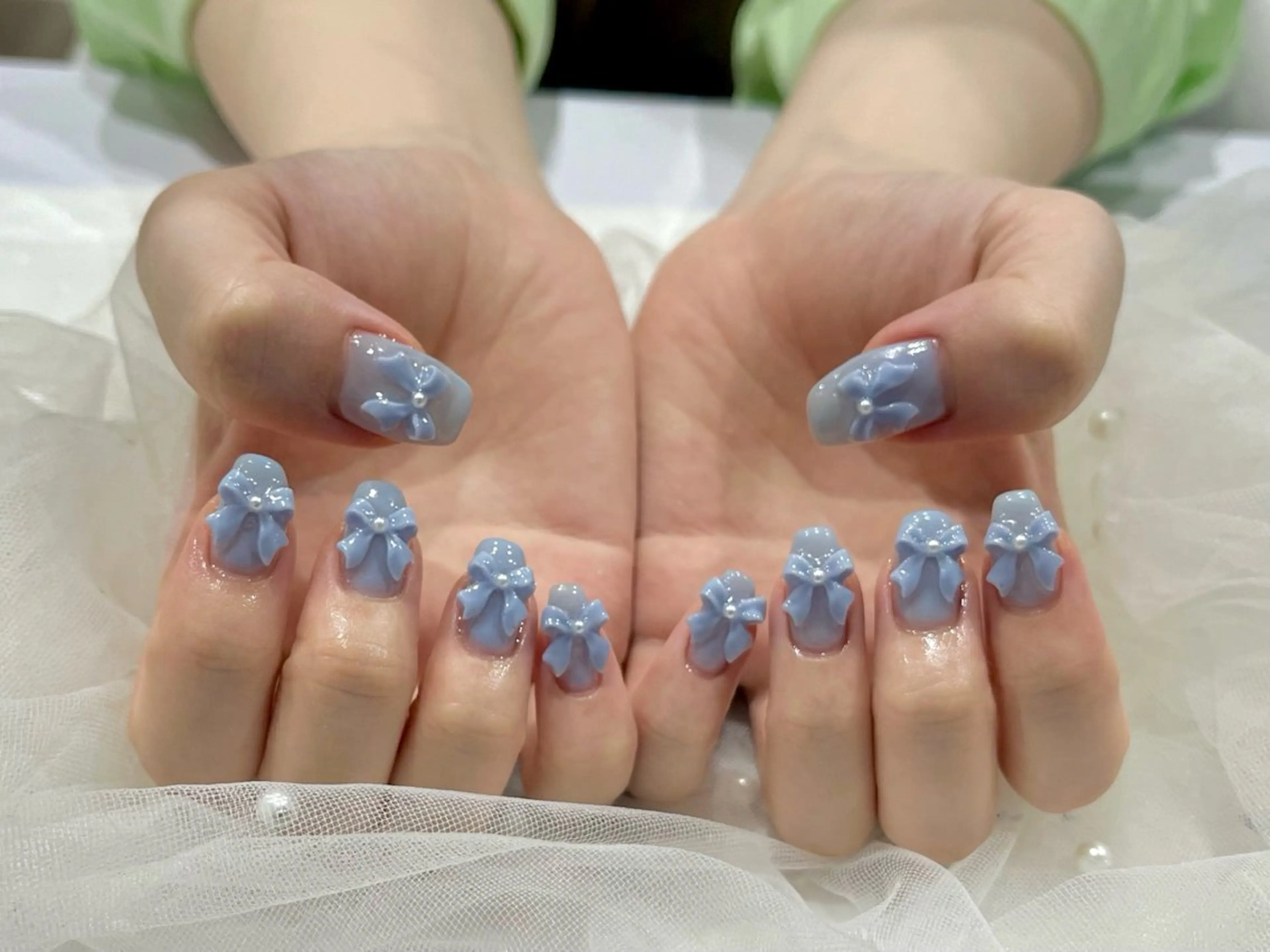 ネイル 水色 リボン ハンドネイル Nail salon Cielel⟡Ayaのネイルデザイン