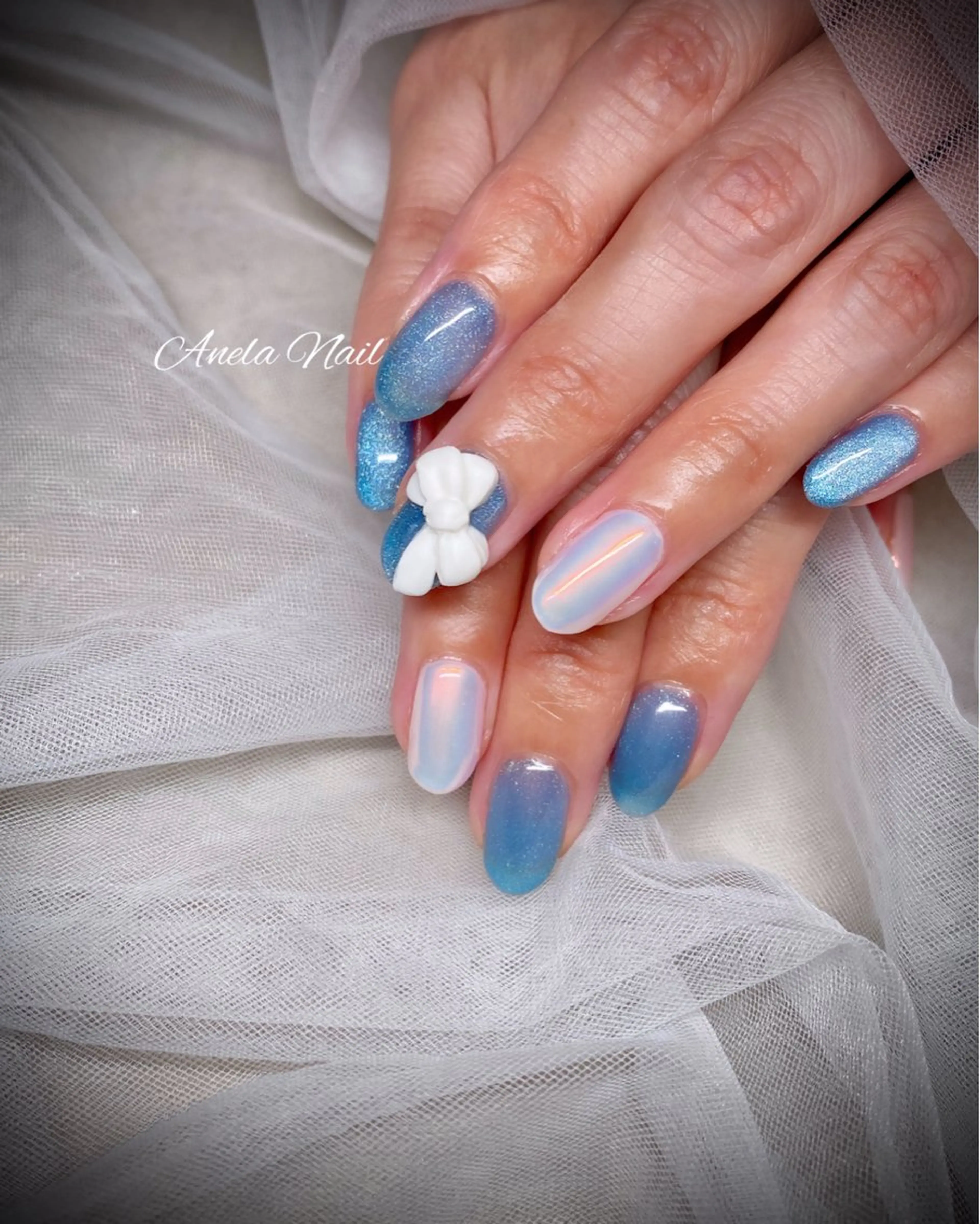 ネイル アートネイル ワンカラーネイル リボン Anela Nailのネイルデザイン